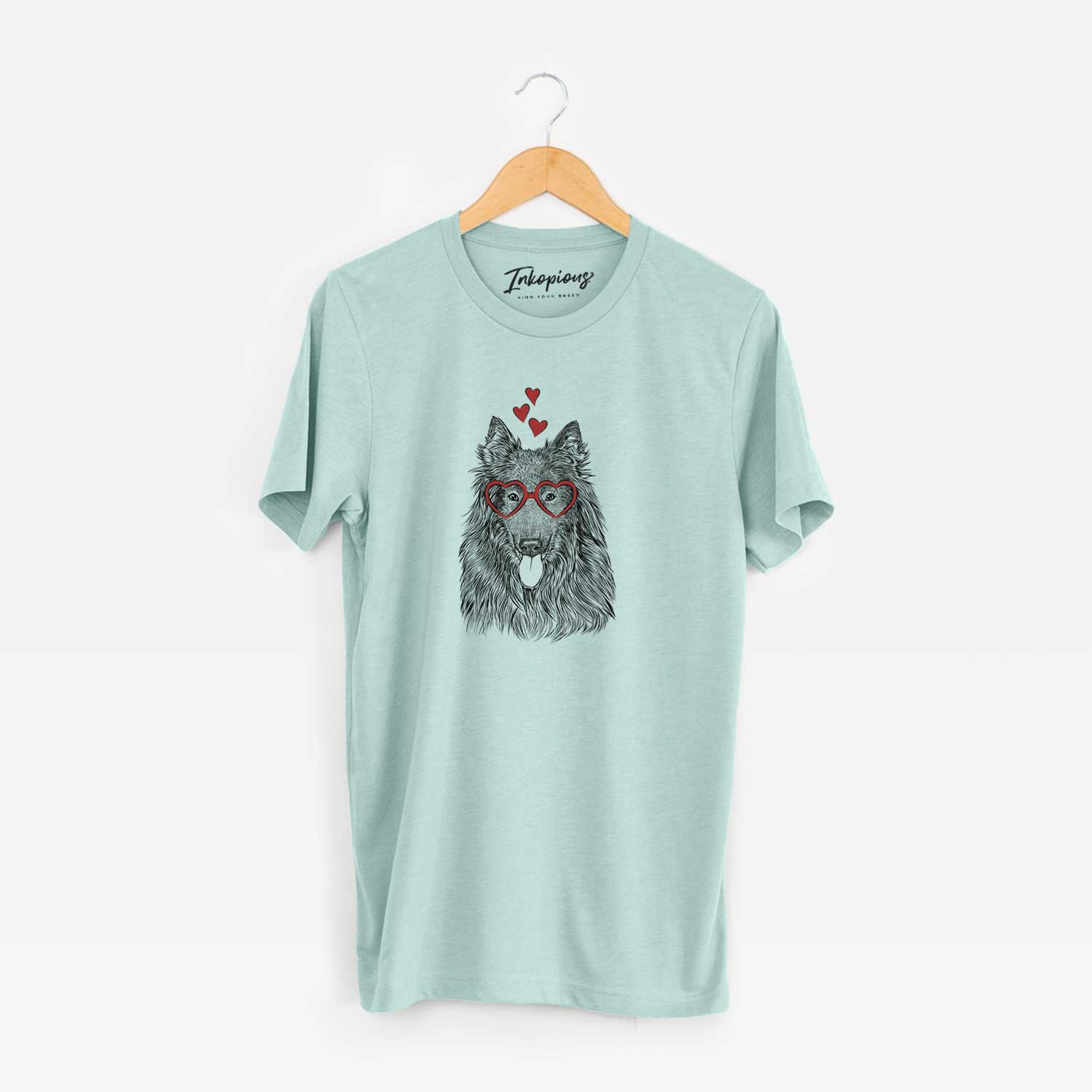 Hand-drawn sketch of Daan the Belgian Shepherd wearing heart-shaped glasses on a Heather Sage Unisex crewneck