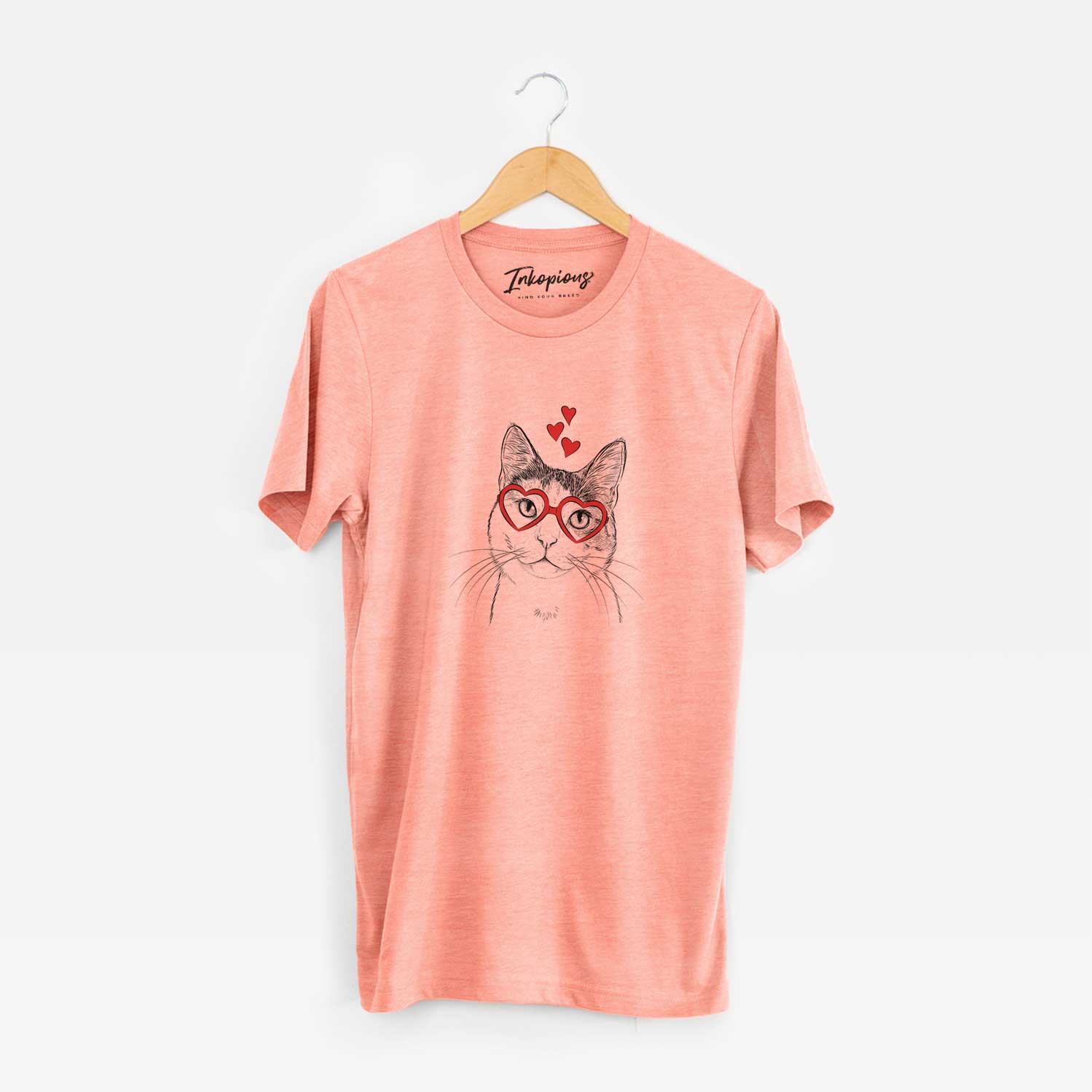 Hand-drawn sketch of Denver the Calico Cat wearing heart-shaped glasses on a Sunset Unisex crewneck