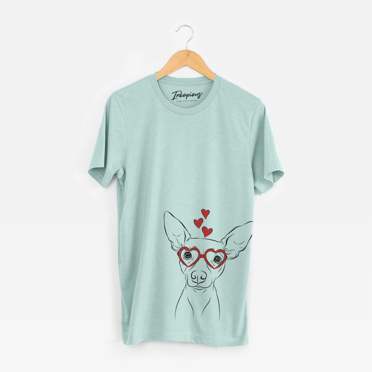 Hand-drawn sketch of Desi the American Hairless Terrier wearing heart-shaped glasses on a Heather Sage Unisex crewneck