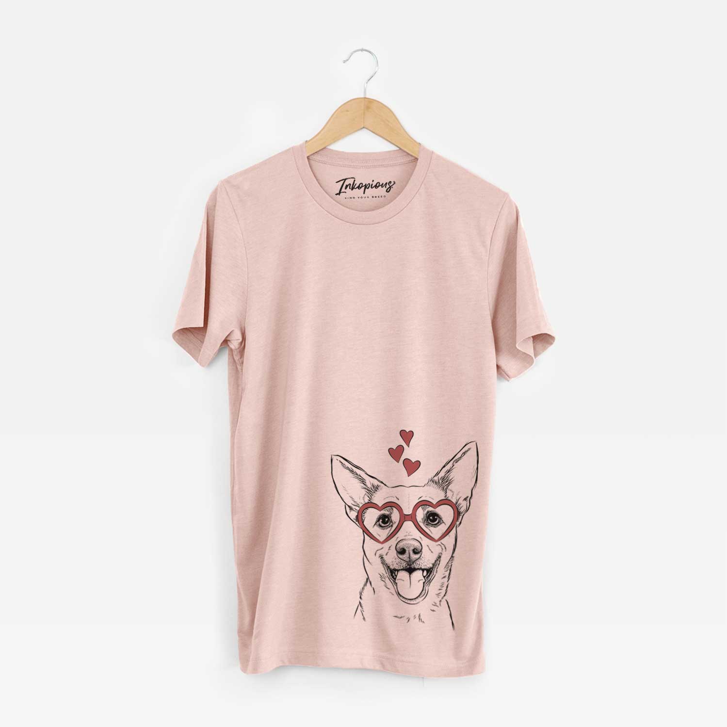 Hand-drawn sketch of Dinghy the Mixed Breed wearing heart-shaped glasses on a Peach Unisex crewneck