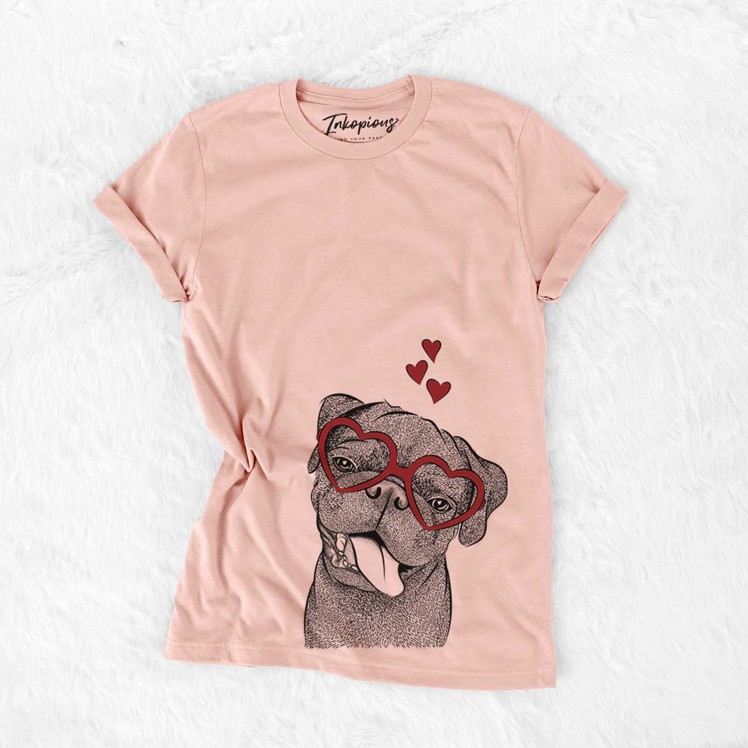 Hand-drawn sketch of Dudley Danger the Pug wearing heart-shaped glasses on a Peach Bella Canvas Unisex Crewneck