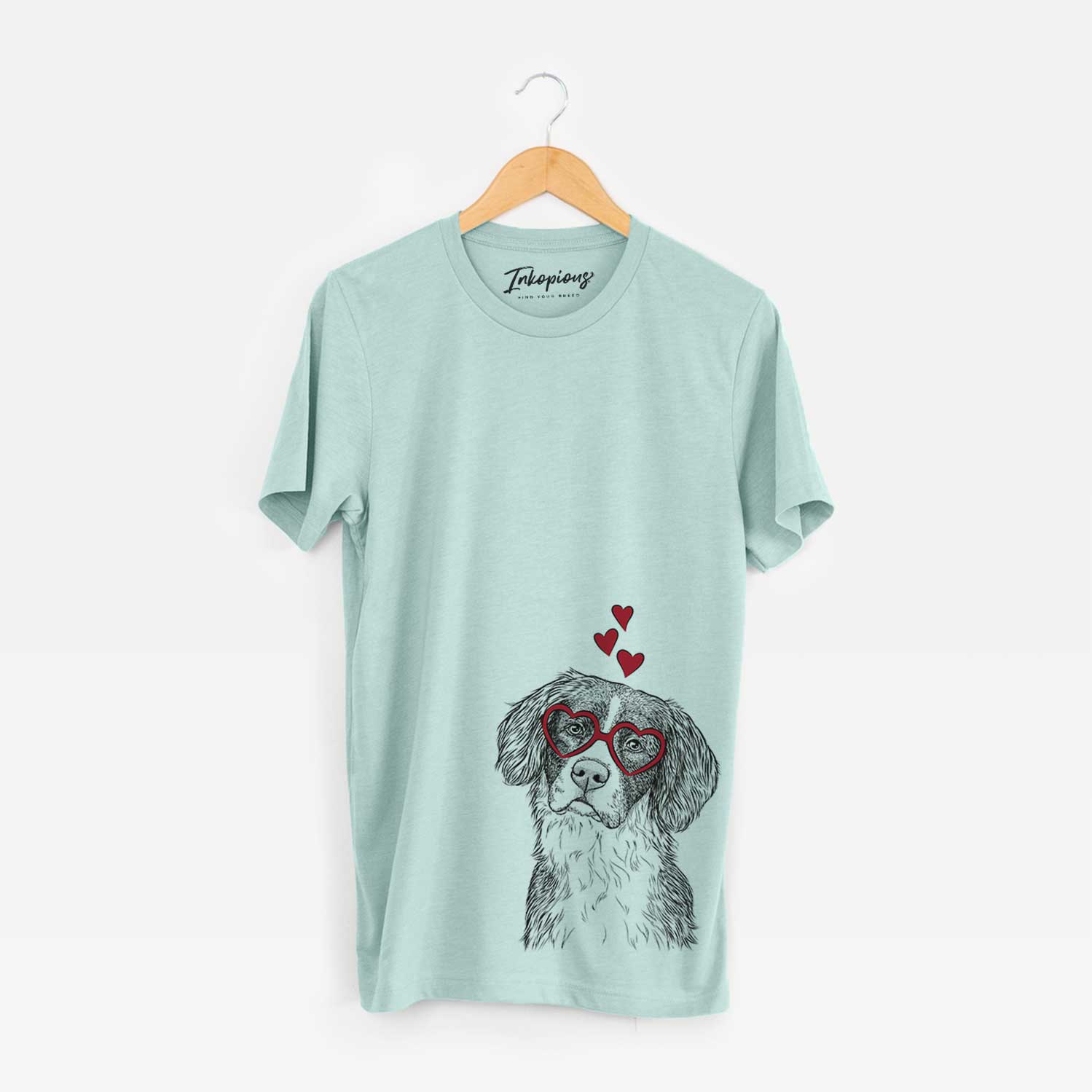 Hand-drawn sketch of Dulce the Drentsche Patrijshond wearing heart-shaped glasses on a Heather Sage Bella Canvas Unisex Crewneck