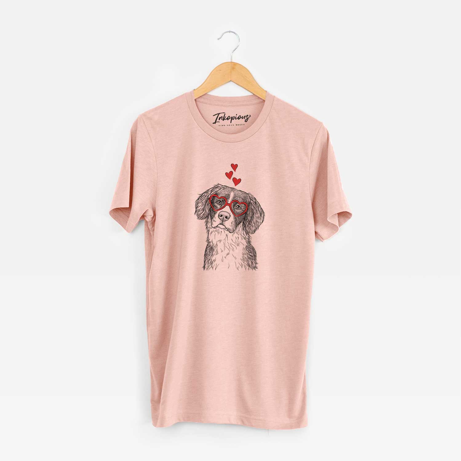 Hand-drawn sketch of Dulce the Drentsche Patrijshond wearing heart-shaped glasses on a Peach Unisex crewneck