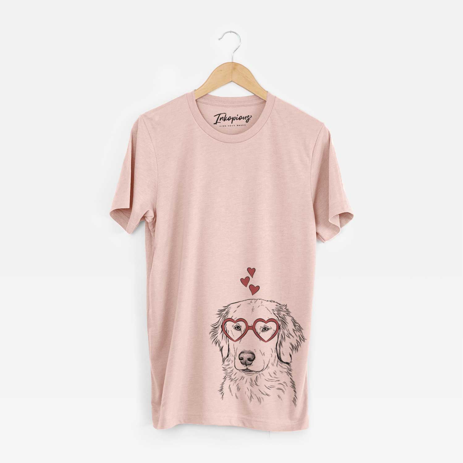 Hand-drawn sketch of Eli the Golden Retriever wearing heart-shaped glasses on a Peach Unisex crewneck