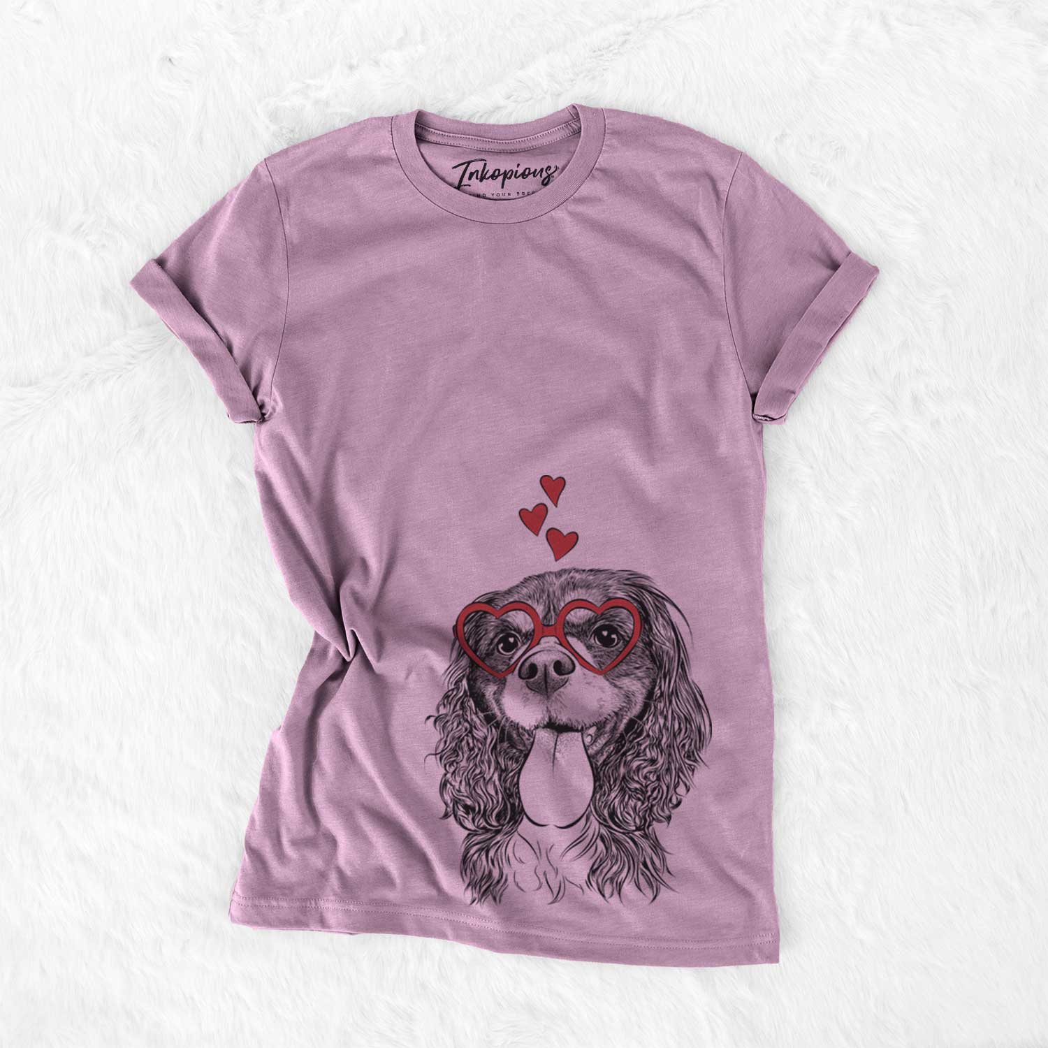 Hand-drawn sketch of Elizabeth the Cavalier King Charles Spaniel wearing heart-shaped glasses on an Orchid Bella Canvas Unisex Crewneck