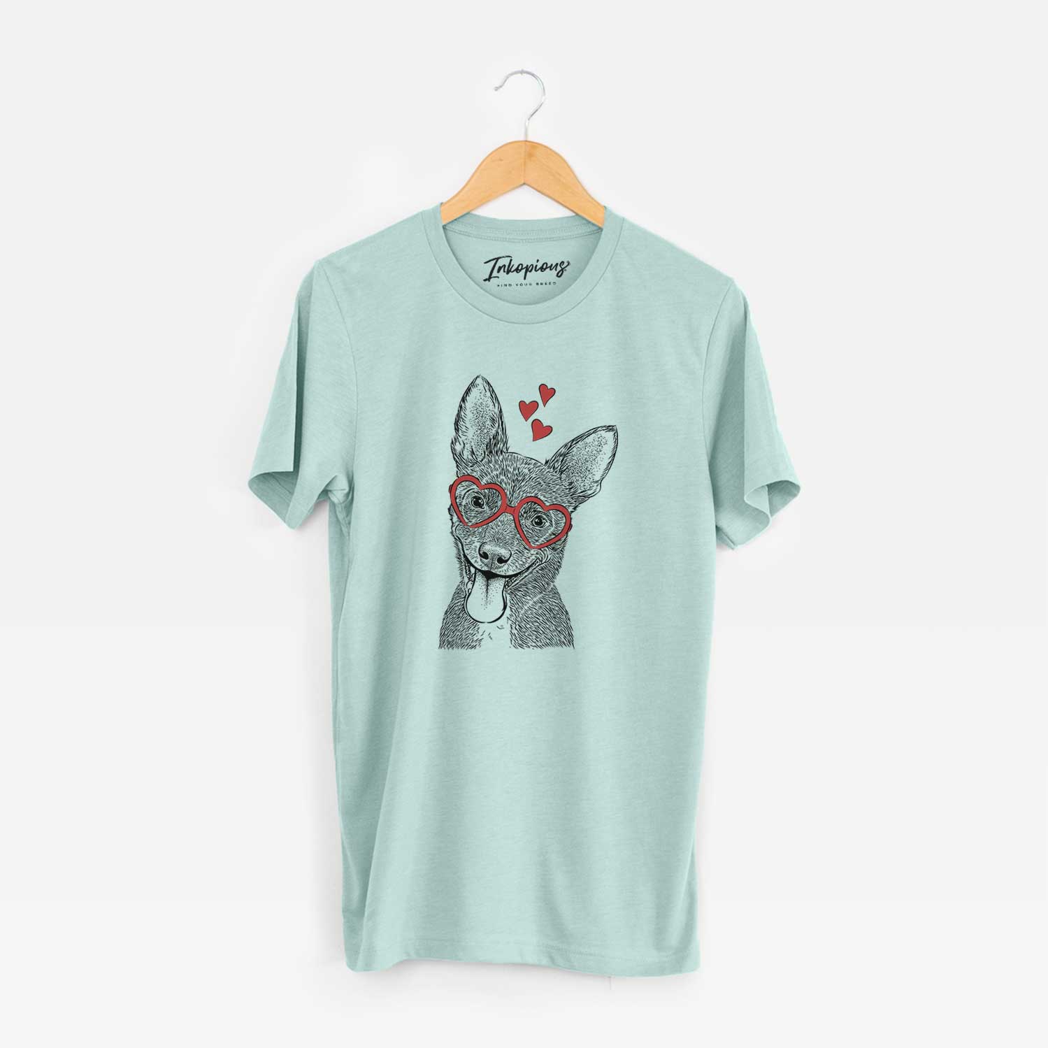 Hand-drawn sketch of Elvira the Terrier Mix wearing heart-shaped glasses on a Heather Sage Unisex crewneck