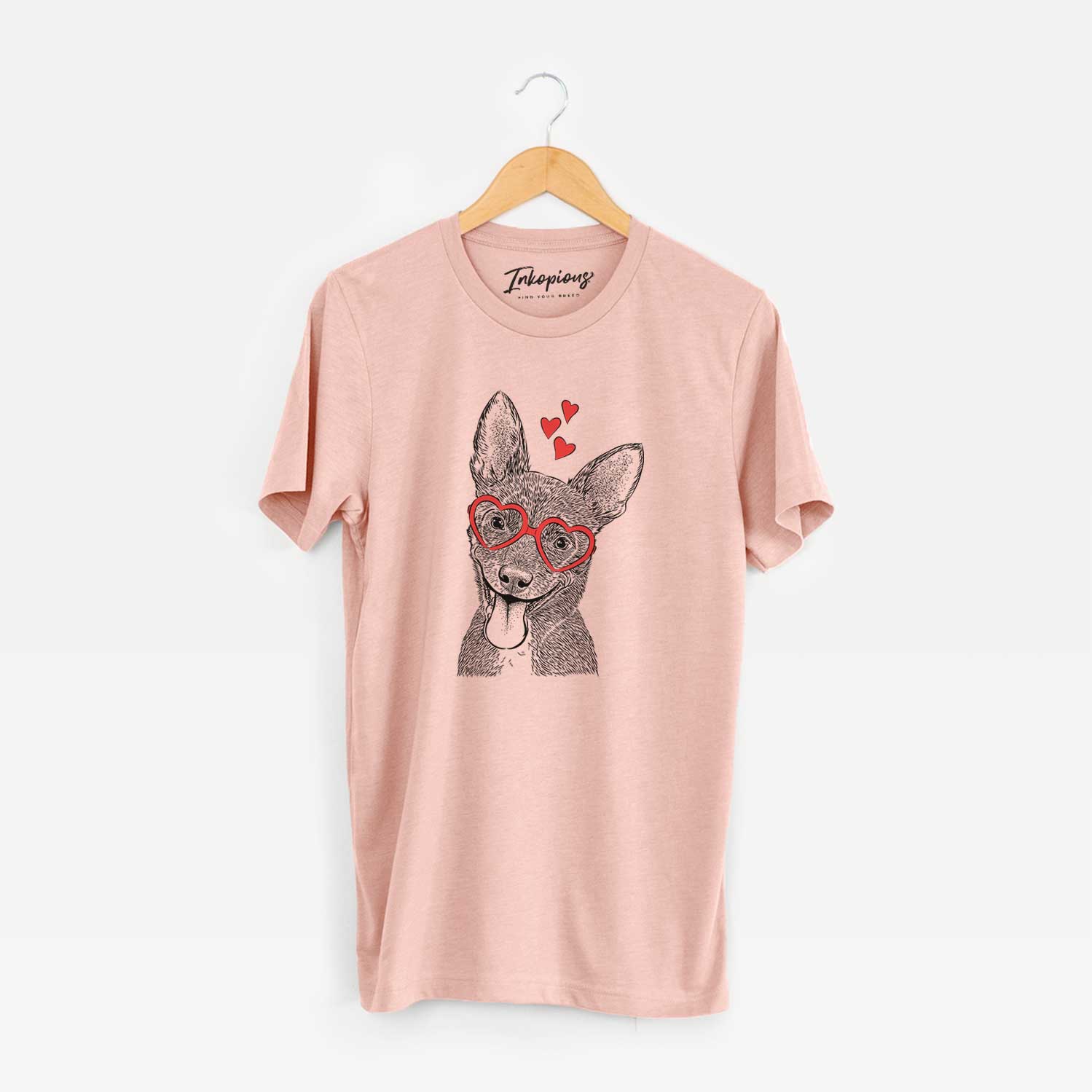 Hand-drawn sketch of Elvira the Terrier Mix wearing heart-shaped glasses on a Peach Unisex crewneck