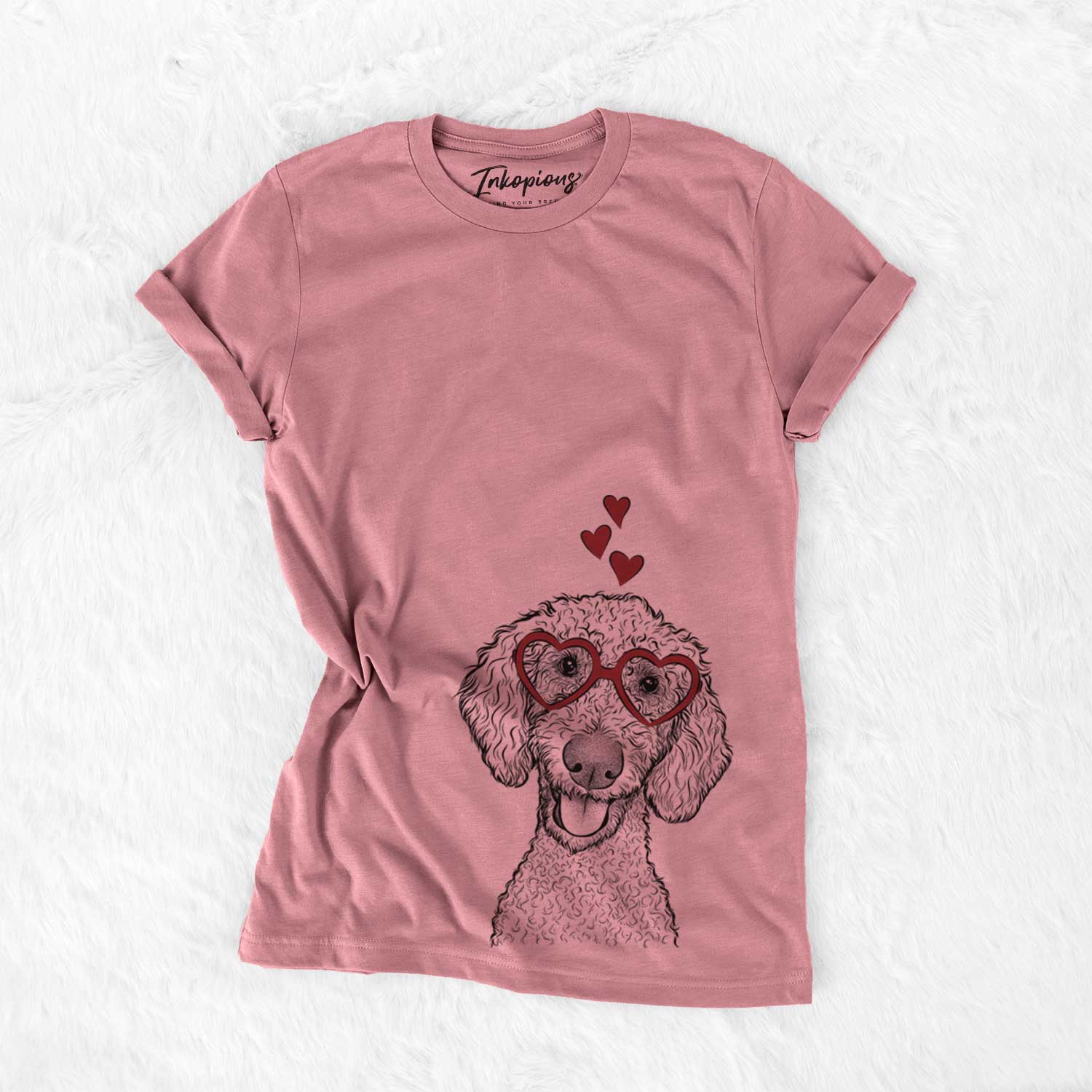 Hand-drawn sketch of Fenway the Goldendoodle wearing heart-shaped glasses on a Mauve Bella Canvas Unisex Crewneck