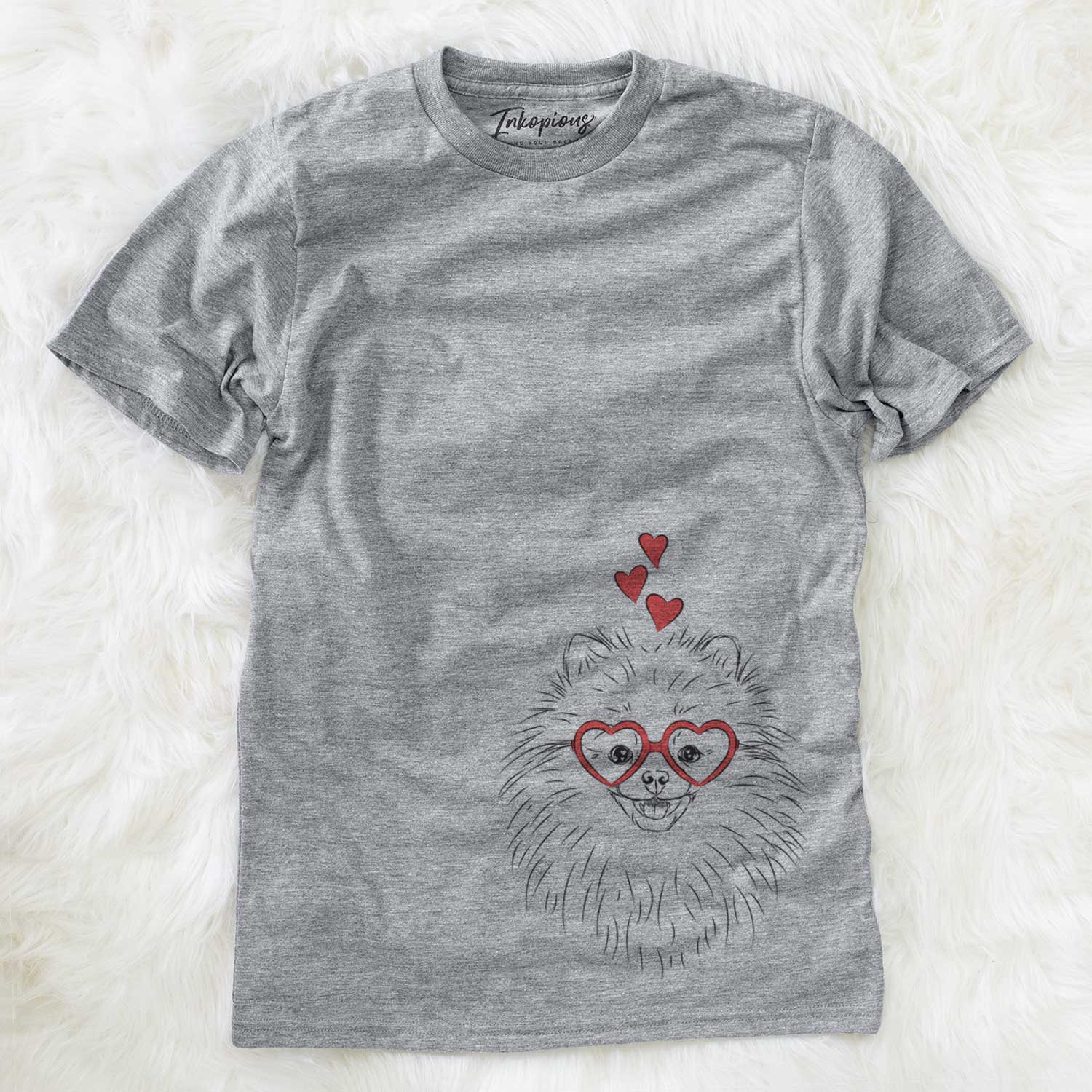 Hand-drawn sketch of Finn the Pomeranian wearing heart-shaped glasses on a Grey Unisex crewneck