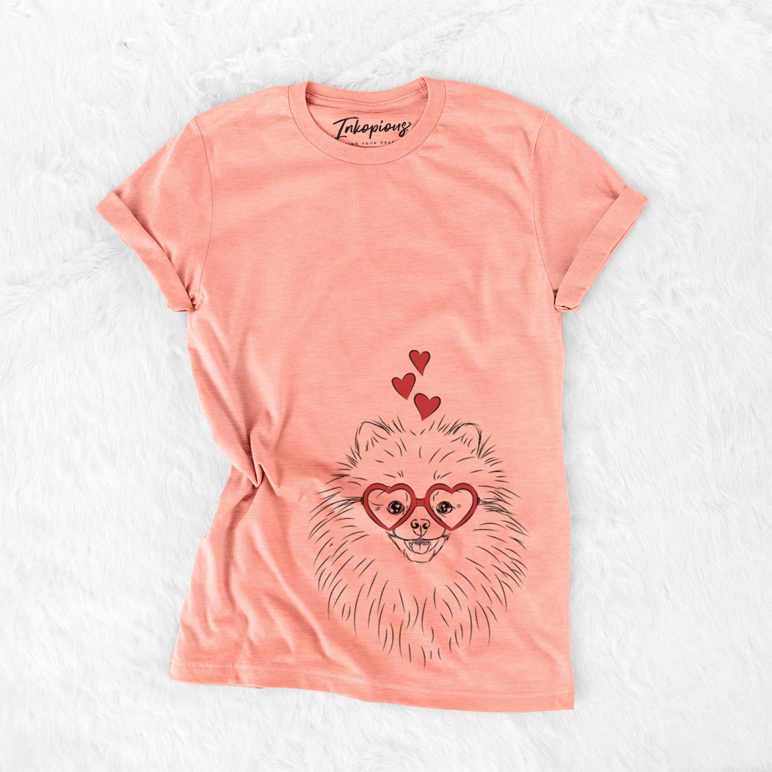 Hand-drawn sketch of Finn the Pomeranian wearing heart-shaped glasses on a Sunset Bella Canvas Unisex Crewneck