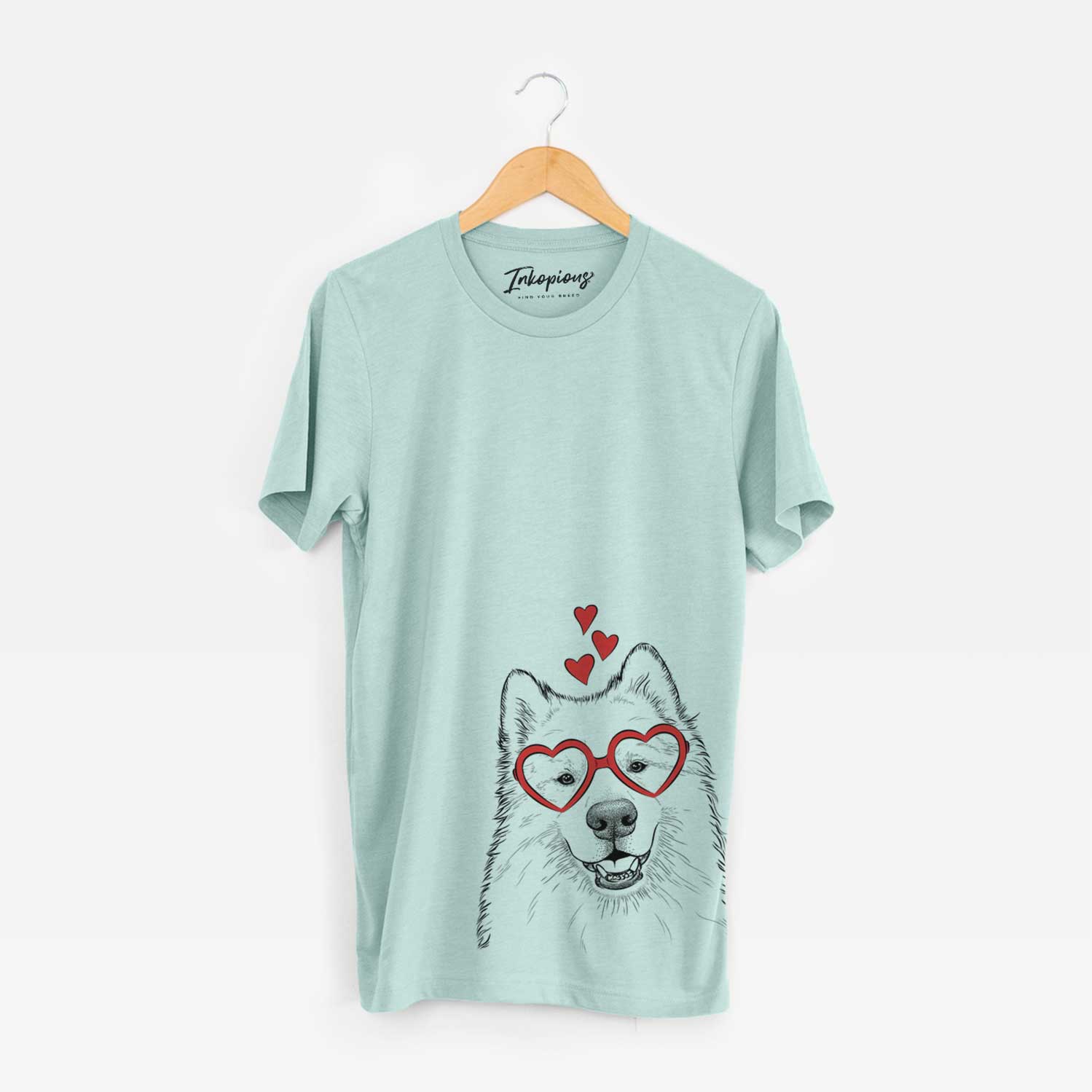 Hand-drawn sketch of Foster the Samoyed wearing heart-shaped glasses on a Heather Sage Bella Canvas Unisex Crewneck