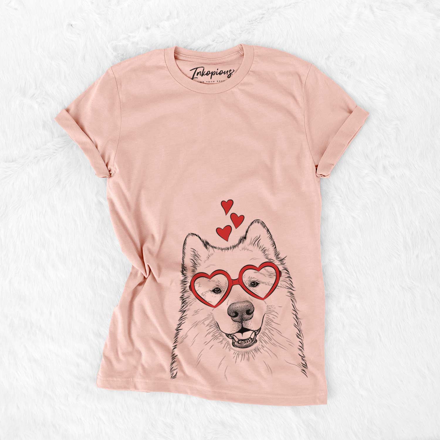 Hand-drawn sketch of Foster the Samoyed wearing heart-shaped glasses on a Peach Bella Canvas Unisex Crewneck