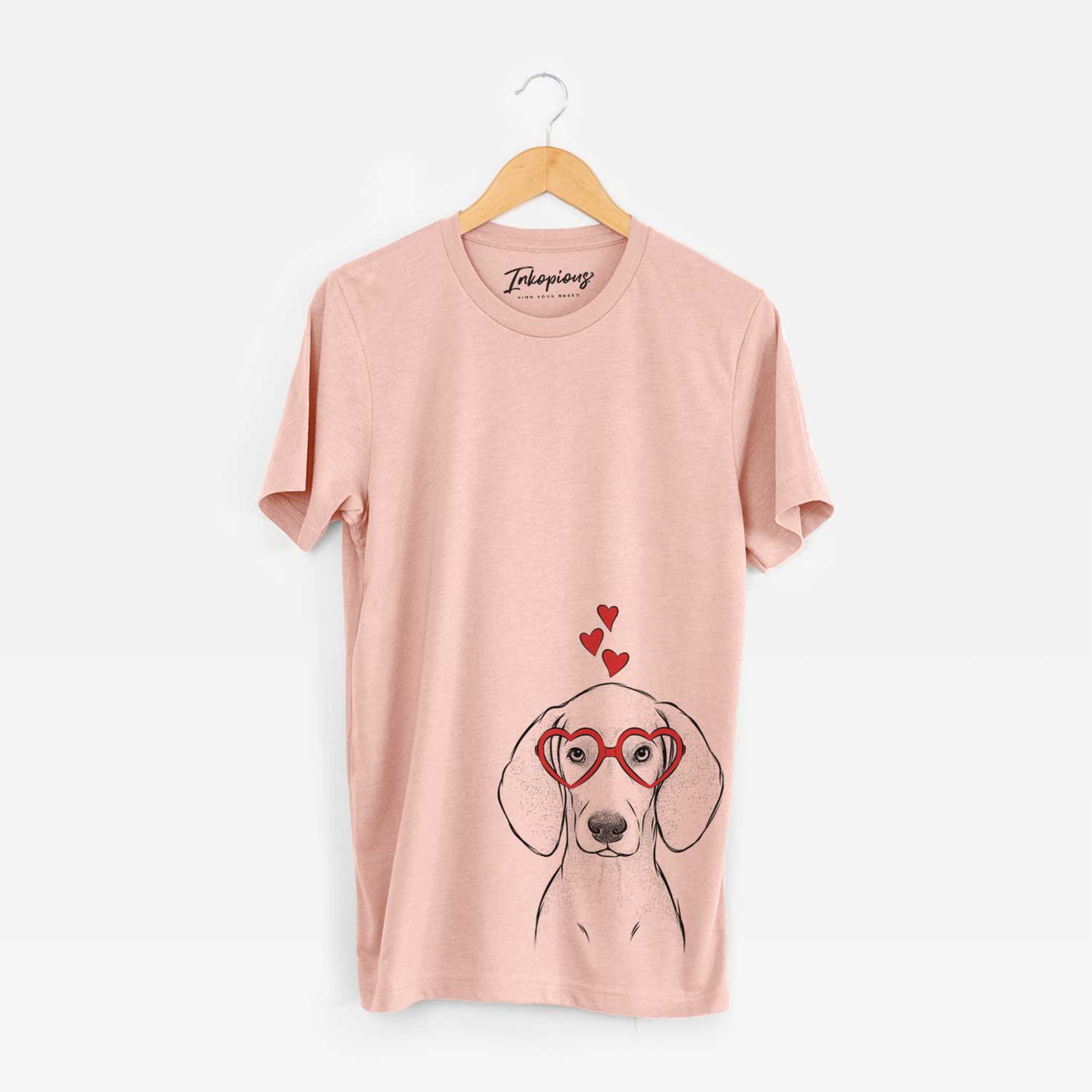 Hand-drawn sketch of Frejya the Weimaraner wearing heart-shaped glasses on a Peach Unisex crewneck
