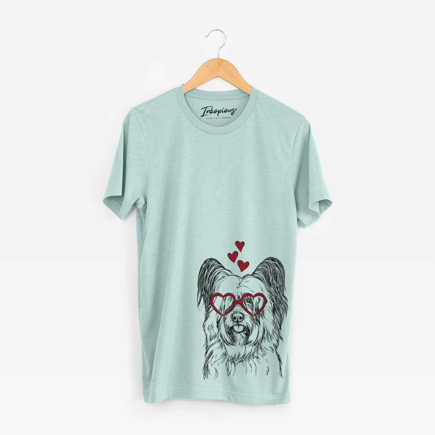 Hand-drawn sketch of Gideon the Skye Terrier wearing heart-shaped glasses on a Heather Sage Bella Canvas Unisex Crewneck