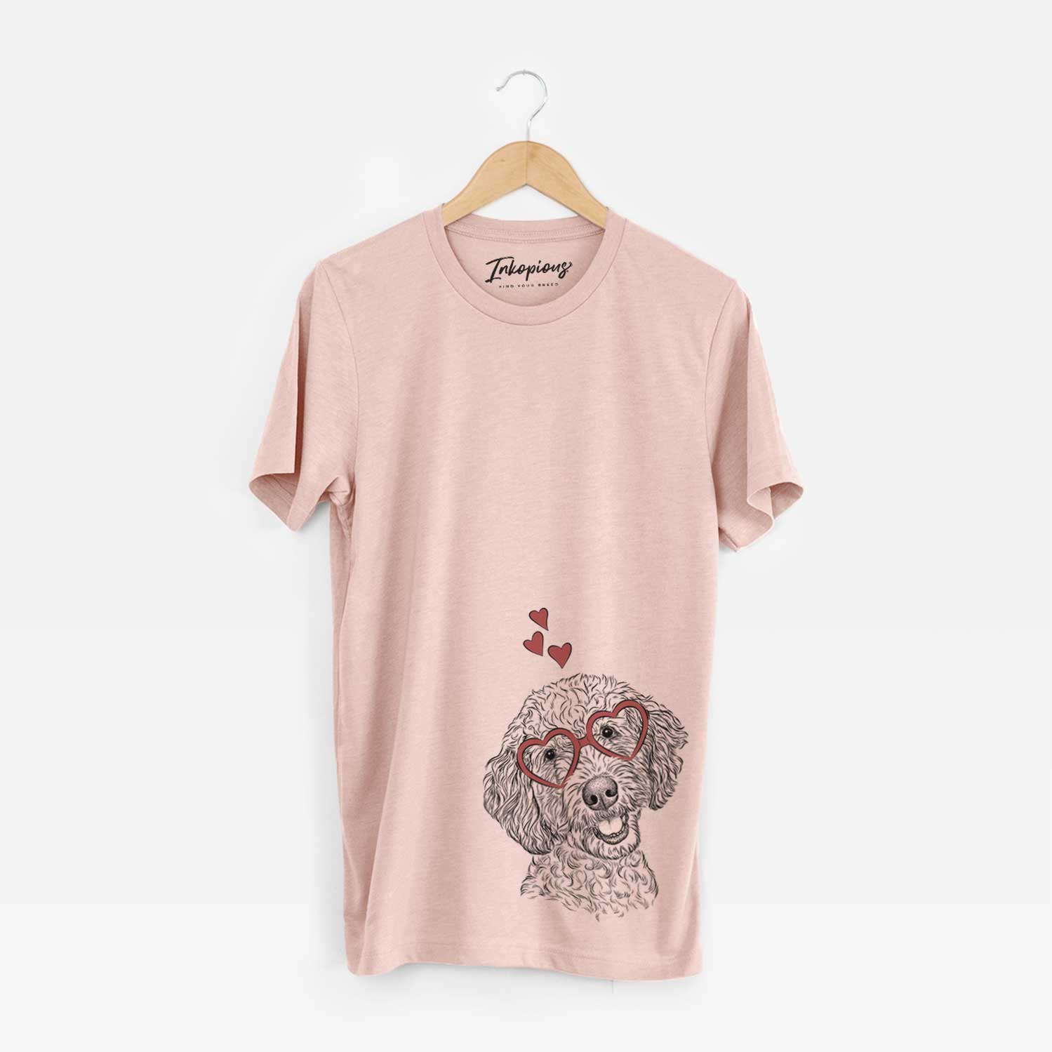 Hand-drawn sketch of Gizmo the Goldendoodle wearing heart-shaped glasses on a Peach Unisex crewneck