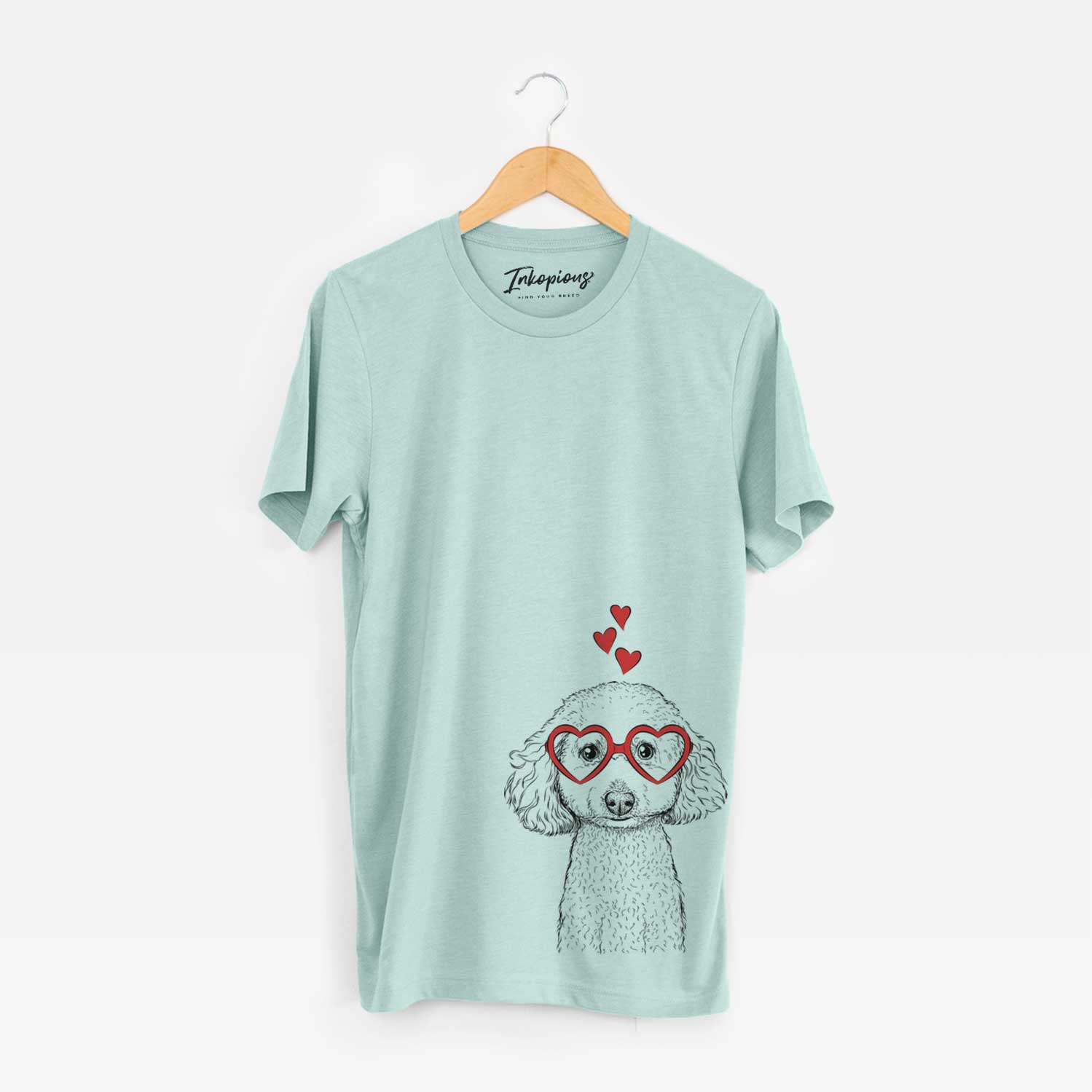 Hand-drawn sketch of Guinness the Toy Poodle Mix wearing heart-shaped glasses on a Heather Sage Unisex crewneck