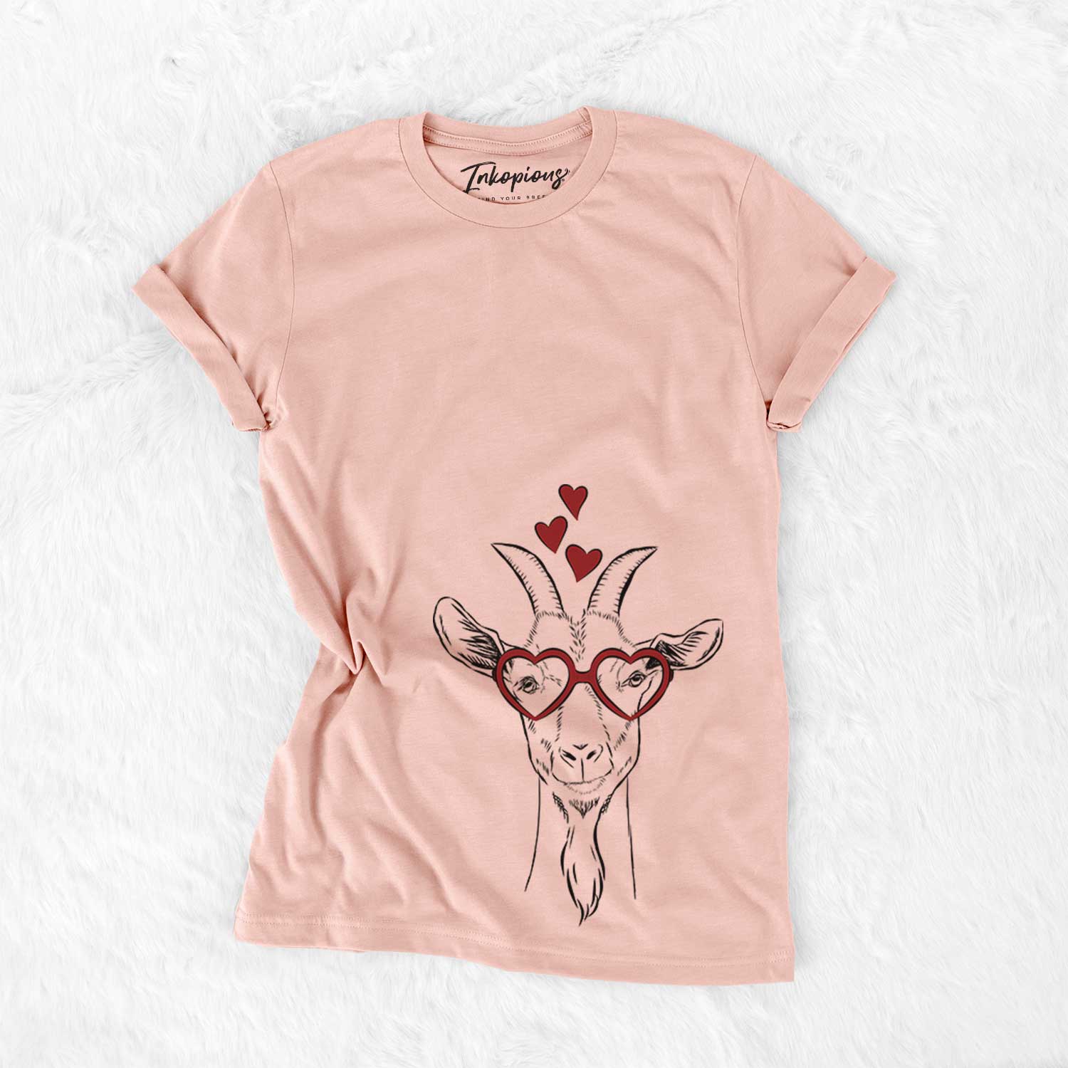 Hand-drawn sketch of Gunnar the Goat wearing heart-shaped glasses on a Peach Bella Canvas Unisex Crewneck