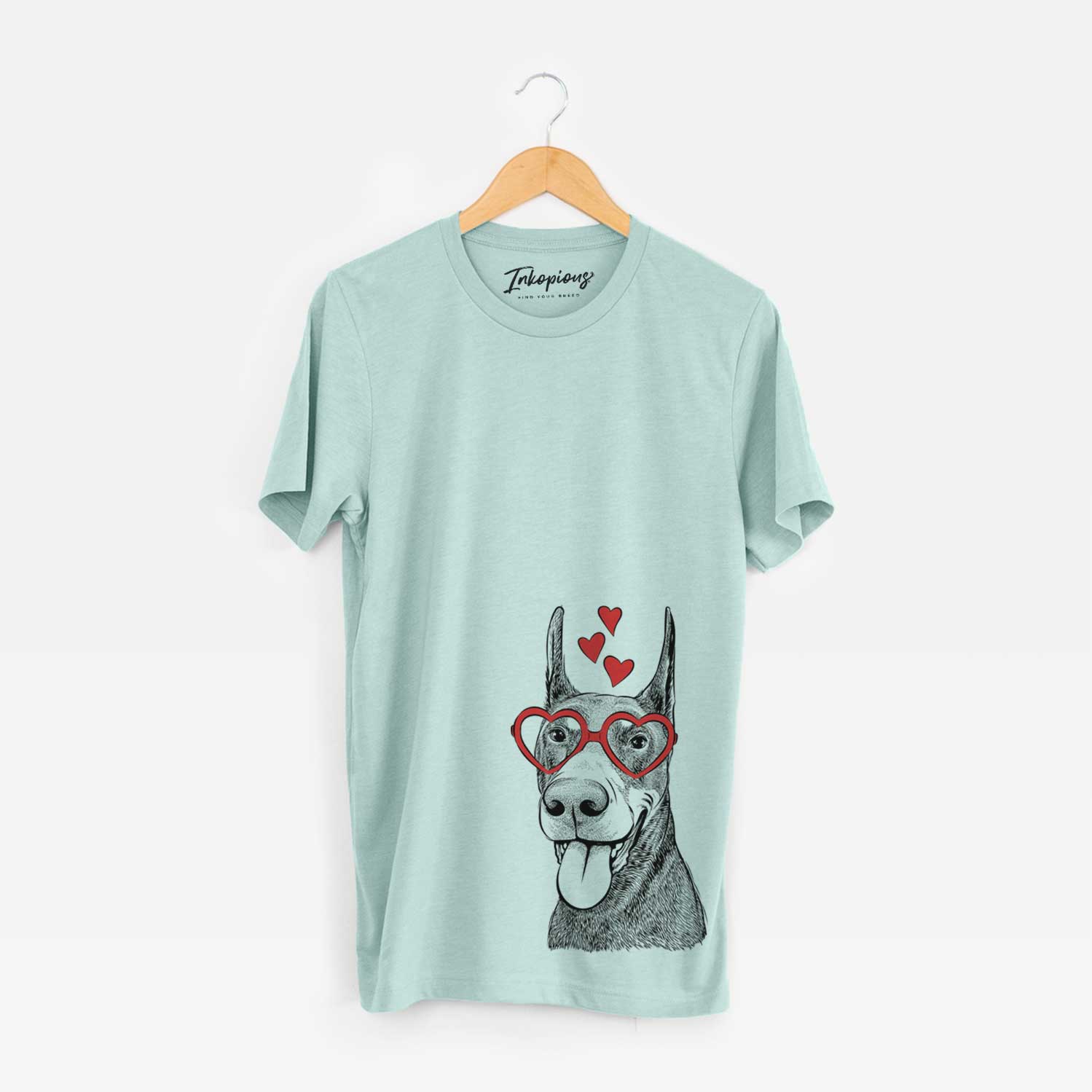Hand-drawn sketch of Happy Sunny the Doberman Pinscher wearing heart-shaped glasses on a Heather Sage Bella Canvas Unisex Crewneck