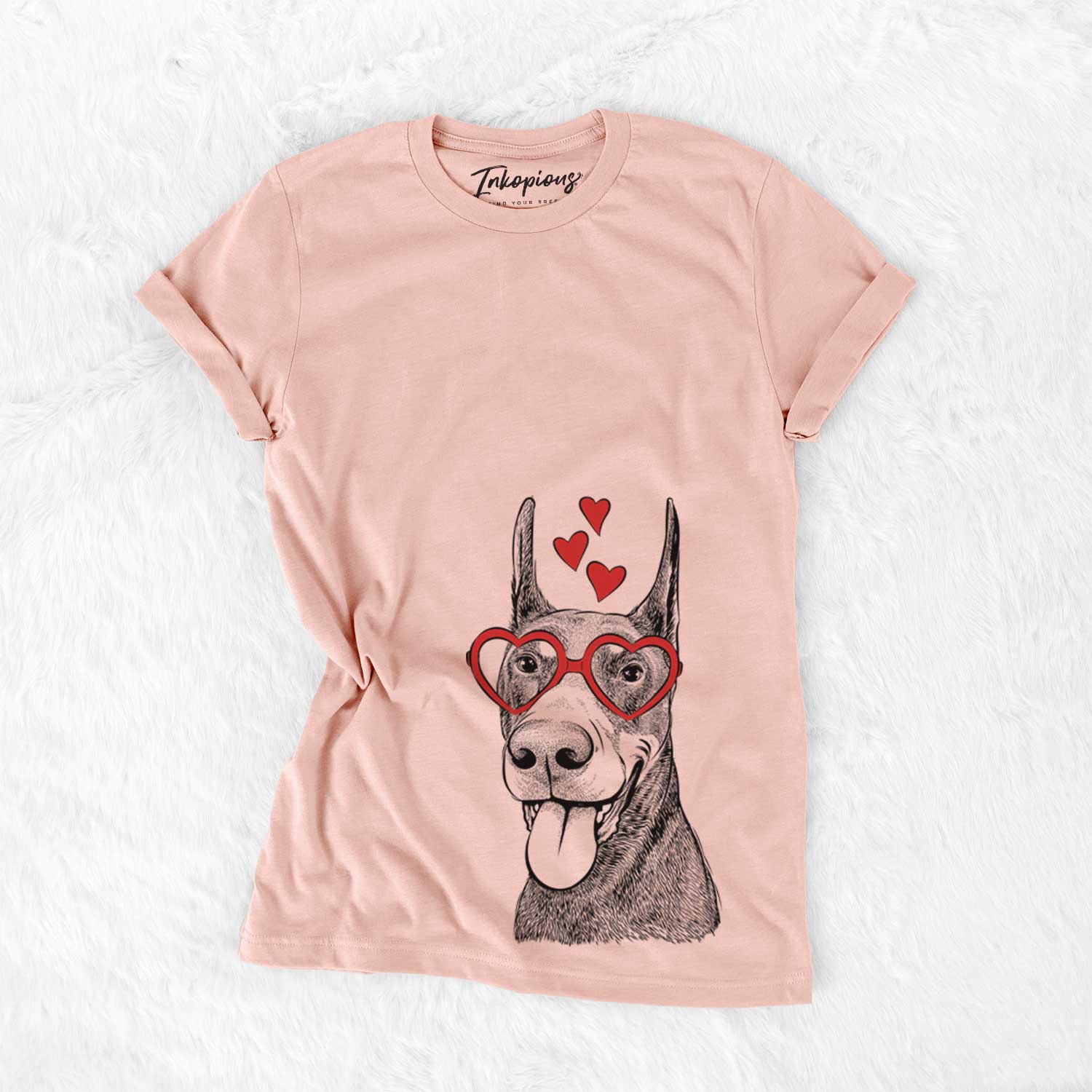 Hand-drawn sketch of Happy Sunny the Doberman Pinscher wearing heart-shaped glasses on a Peach Bella Canvas Unisex Crewneck