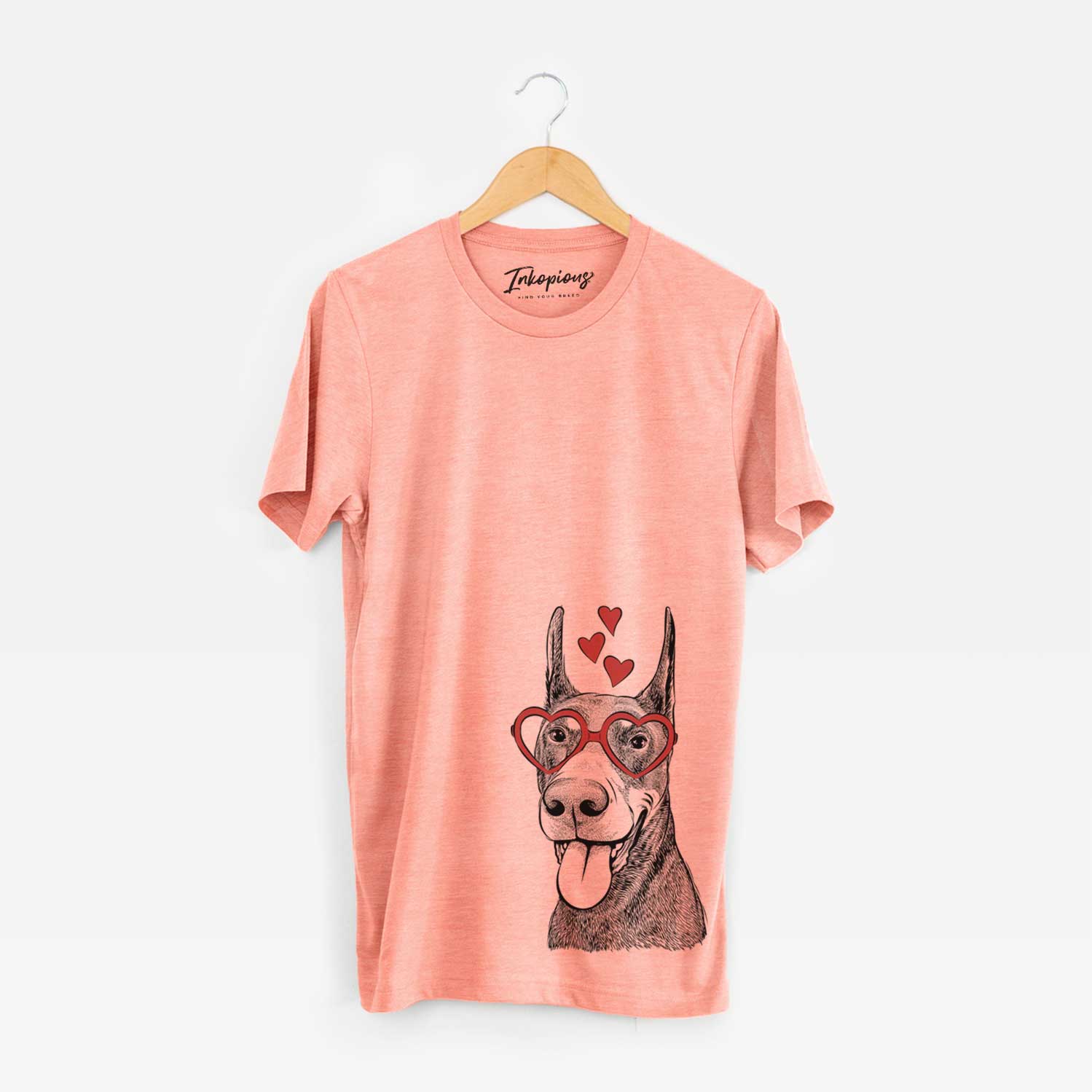 Hand-drawn sketch of Happy Sunny the Doberman Pinscher wearing heart-shaped glasses on a Sunset Unisex crewneck