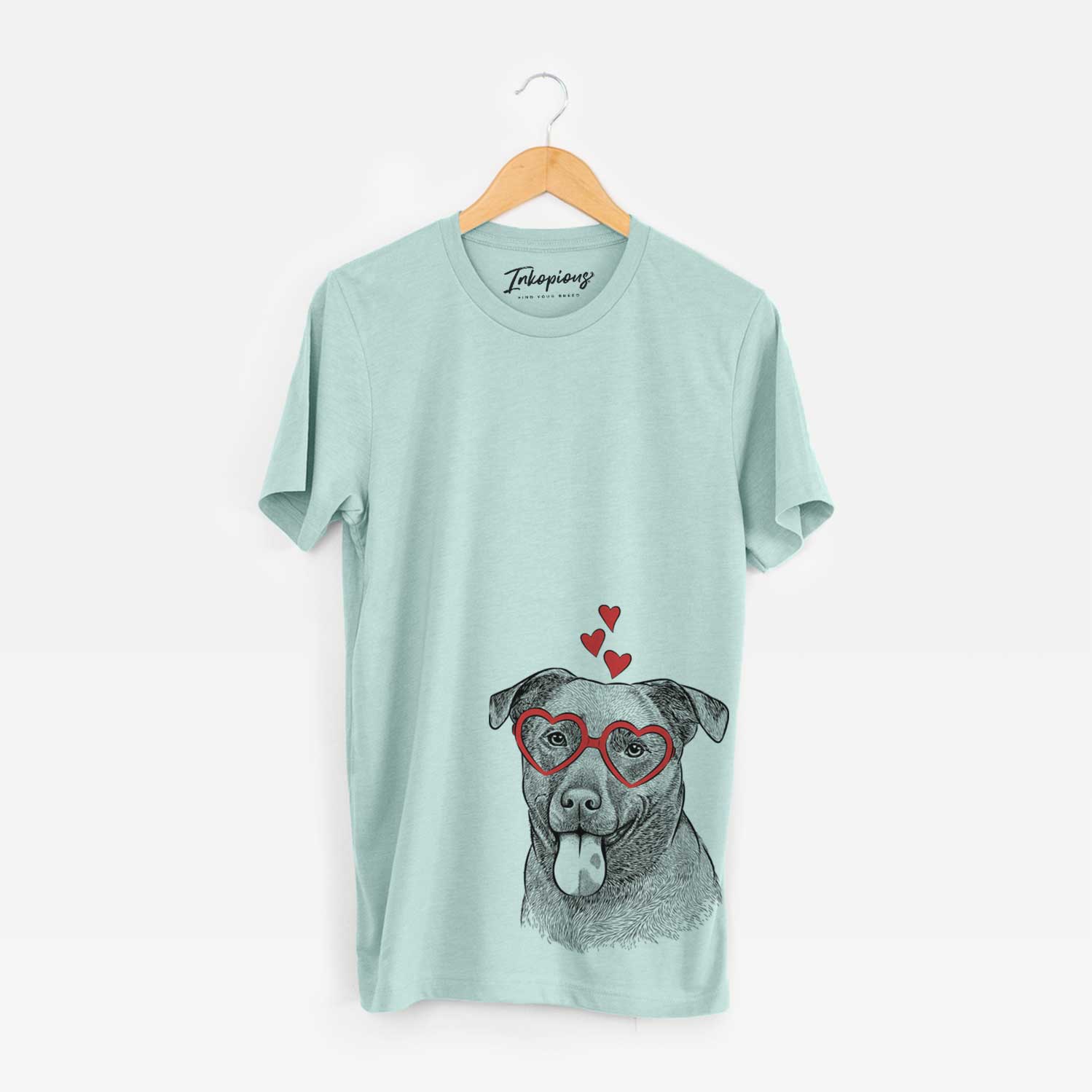 Hand-drawn sketch of Harbor the Mixed Breed wearing heart-shaped glasses on a Heather Sage Bella Canvas Unisex Crewneck