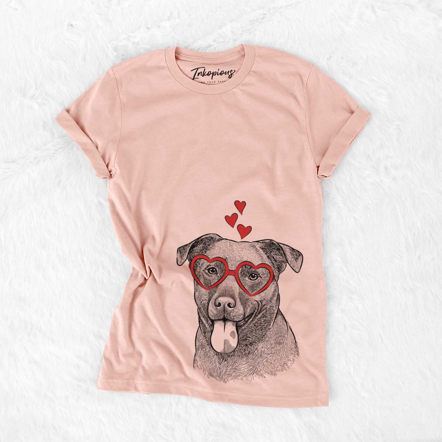 Hand-drawn sketch of Harbor the Mixed Breed wearing heart-shaped glasses on a Peach Bella Canvas Unisex Crewneck