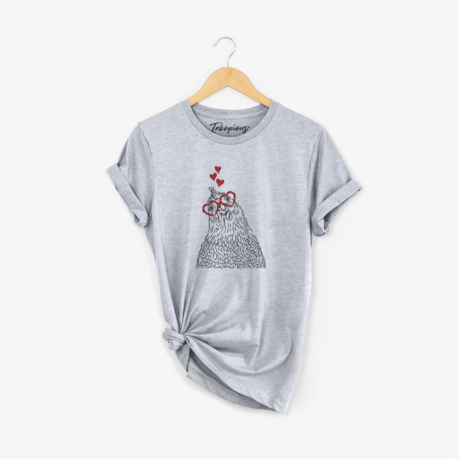 Hand-drawn sketch of Henrietta the Chicken wearing heart-shaped glasses on a Grey Unisex crewneck