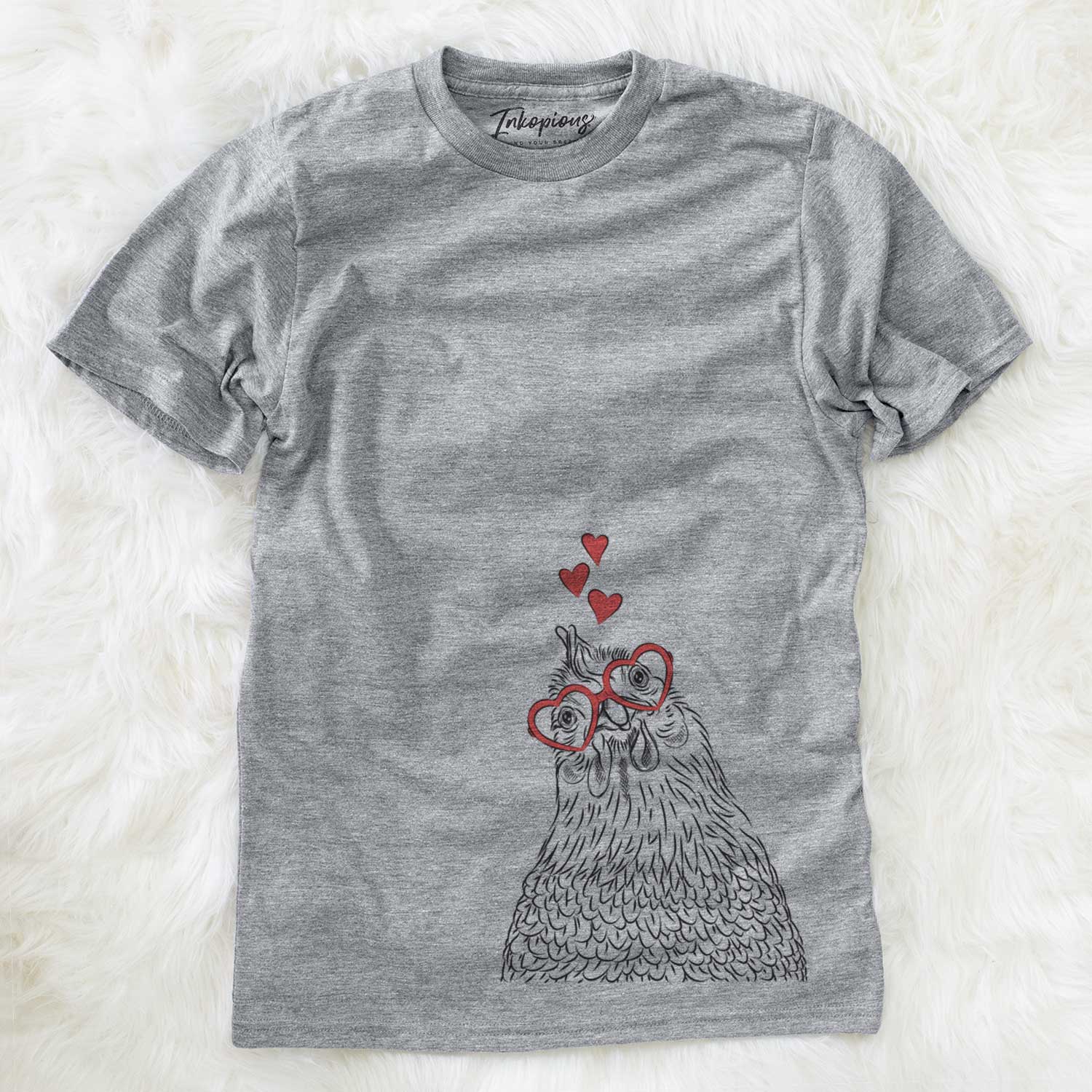 Hand-drawn sketch of Henrietta the Chicken wearing heart-shaped glasses on a Grey Unisex crewneck