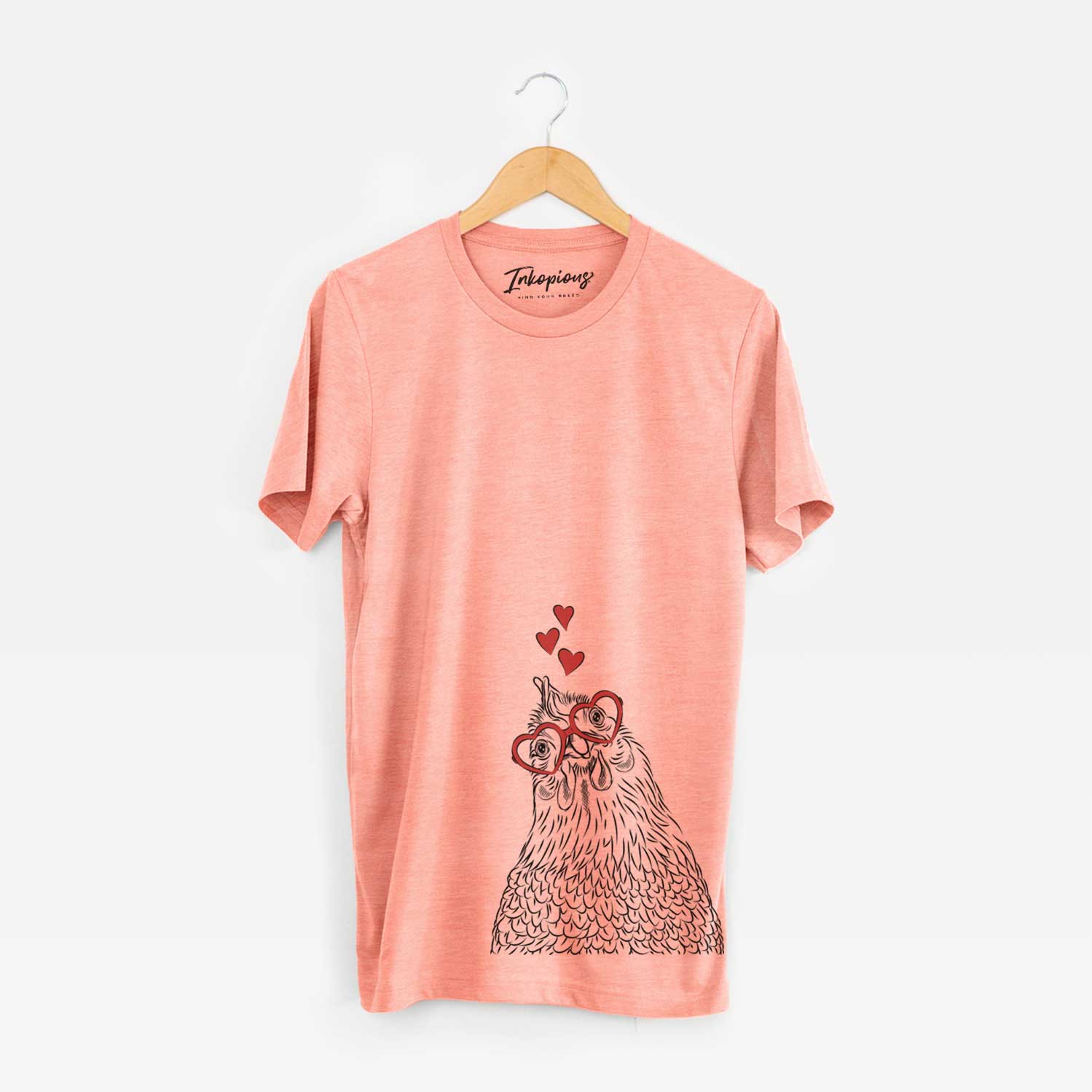 Hand-drawn sketch of Henrietta the Chicken wearing heart-shaped glasses on a Sunset Unisex crewneck