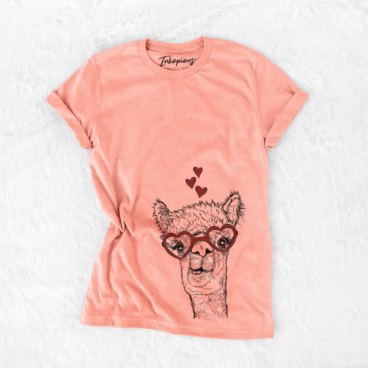 Hand-drawn sketch of Henry the Alpaca wearing heart-shaped glasses on a Sunset Bella Canvas Unisex Crewneck