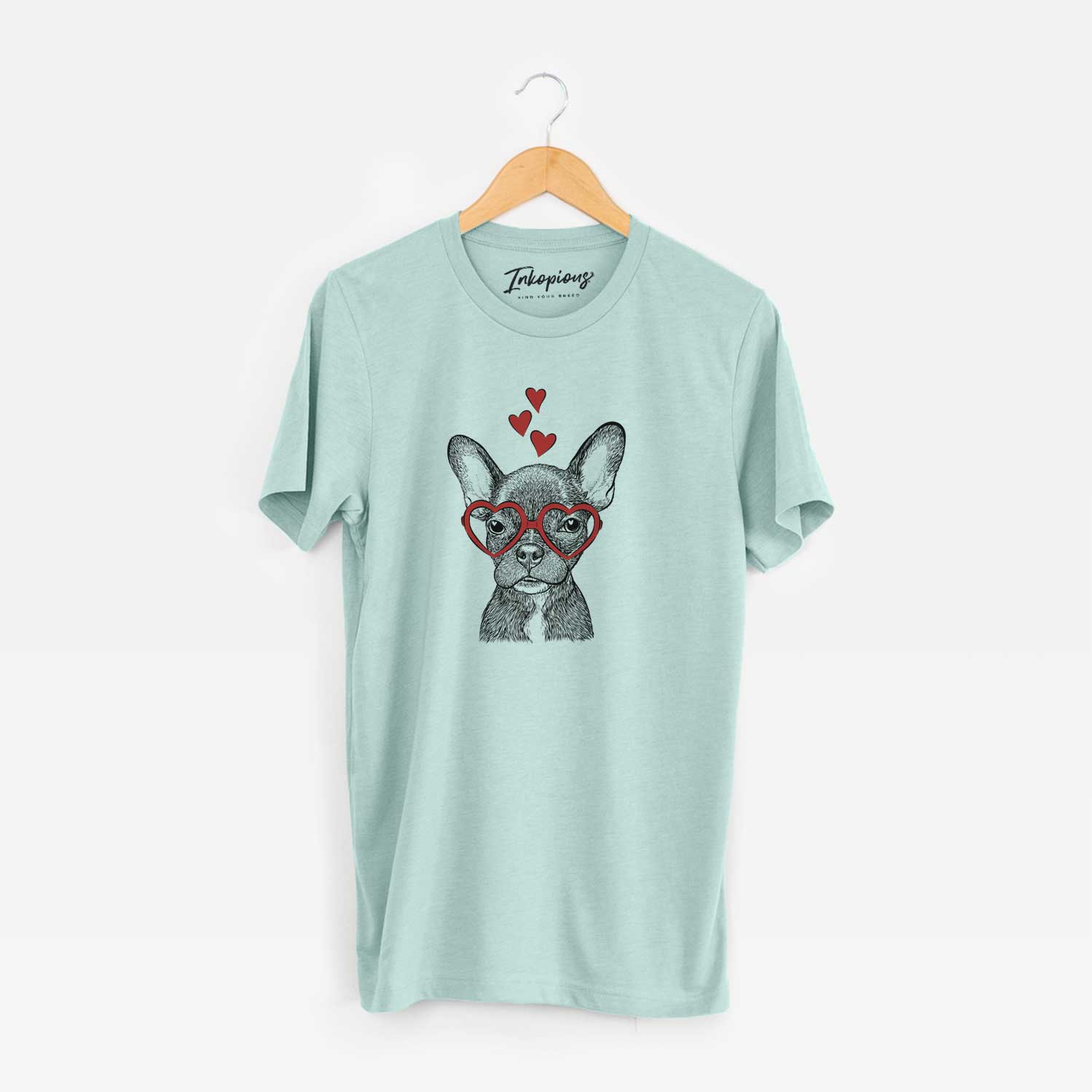 Hand-drawn sketch of Henry the French Bulldog wearing heart-shaped glasses on a Heather Sage Unisex crewneck