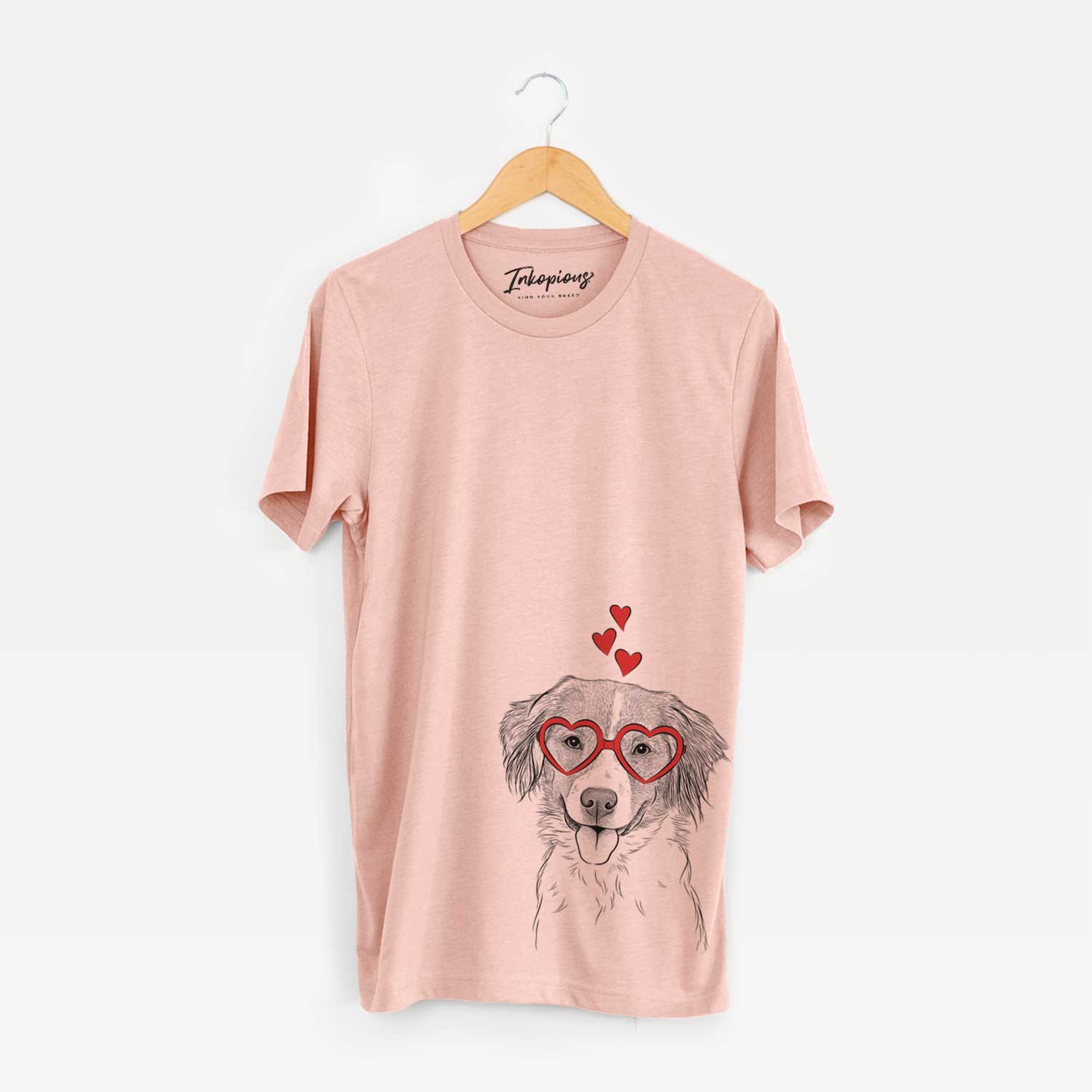 Hand-drawn sketch of Hercules the Nederlandse Kooikerhondje wearing heart-shaped glasses on a Peach Unisex crewneck
