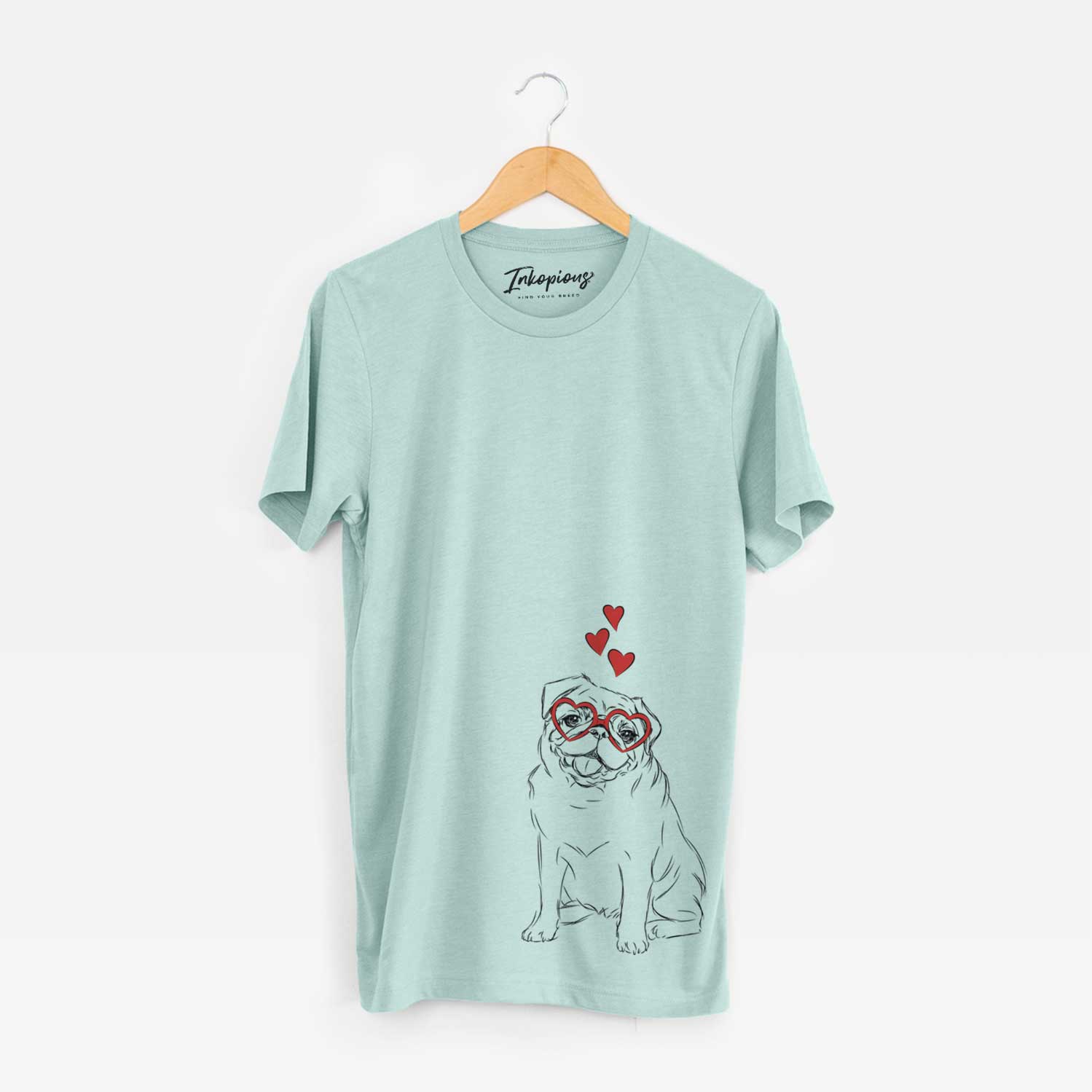 Hand-drawn sketch of Higgins the Pug wearing heart-shaped glasses on a Heather Sage Unisex crewneck