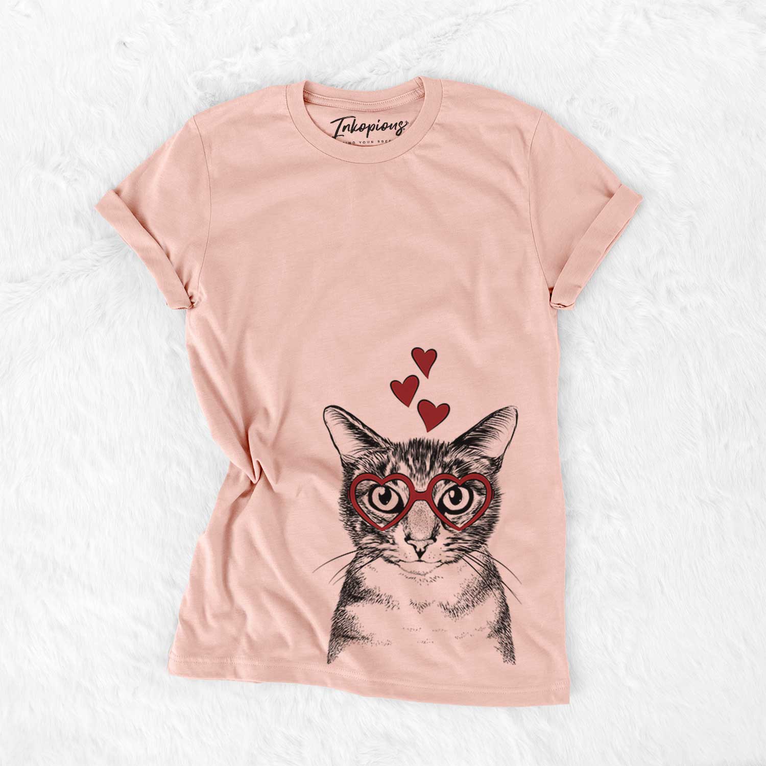 Hand-drawn sketch of Hobbes the Tabby Cat wearing heart-shaped glasses on a Peach Bella Canvas Unisex Crewneck
