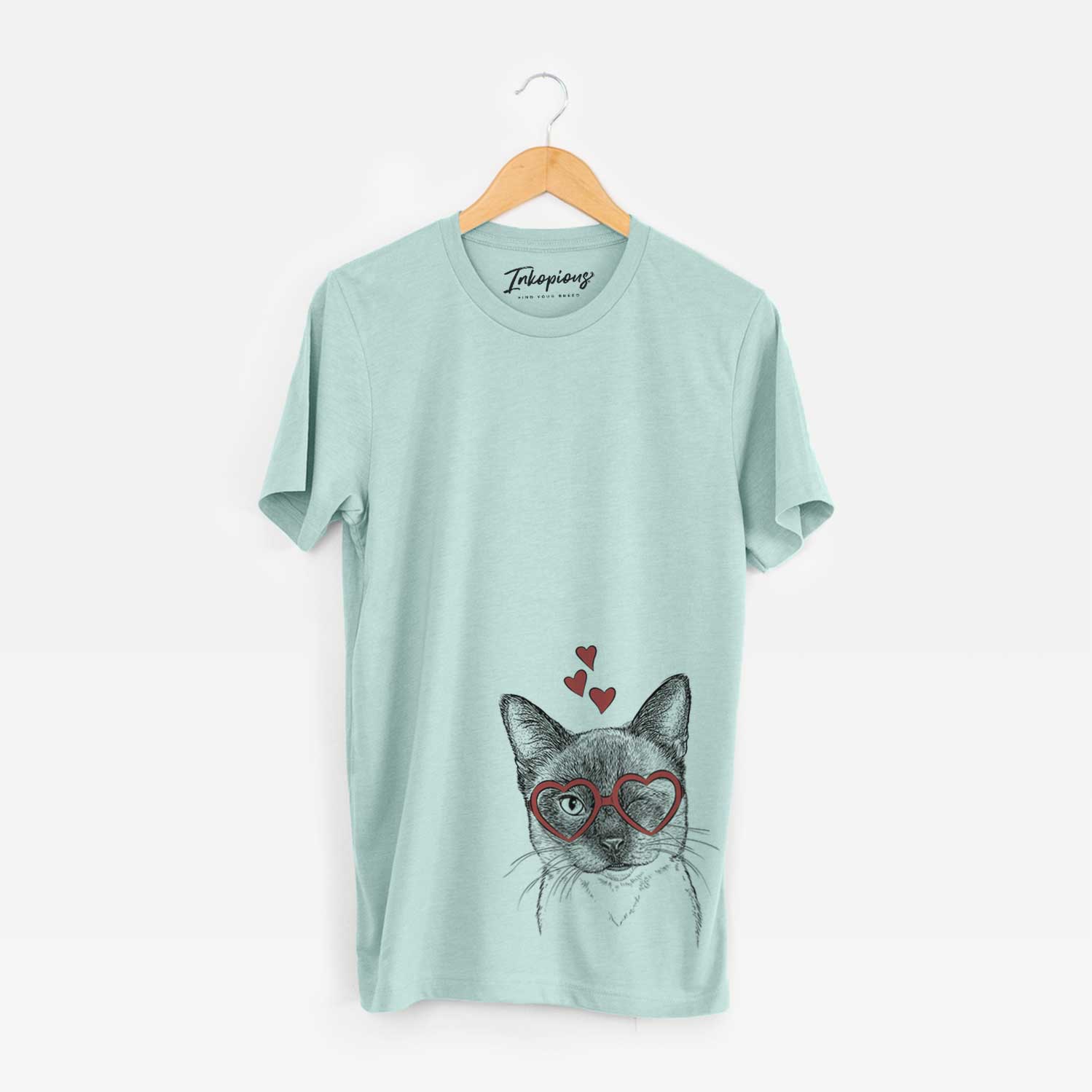 Hand-drawn sketch of Hoggle the Siamese Cat wearing heart-shaped glasses on a Heather Sage Unisex crewneck