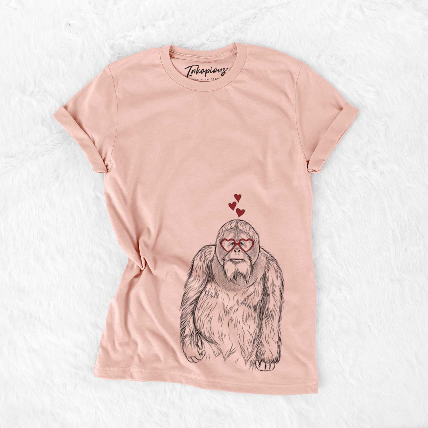 Hand-drawn sketch of Horace the Male Orangutan wearing heart-shaped glasses on a Peach Bella Canvas Unisex Crewneck
