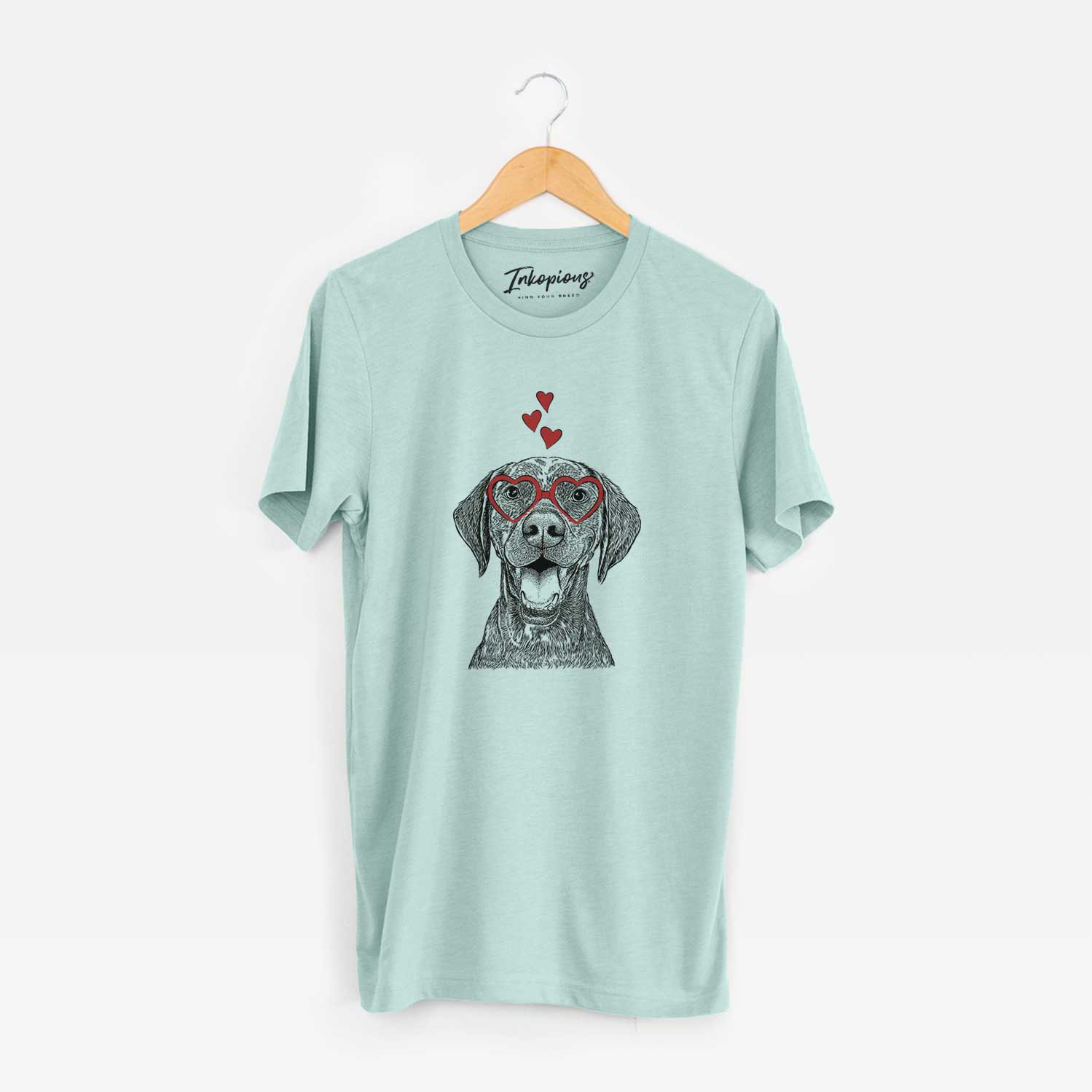 Hand-drawn sketch of Hudson the German Shorthaired Pointer wearing heart-shaped glasses on a Heather Sage Unisex crewneck
