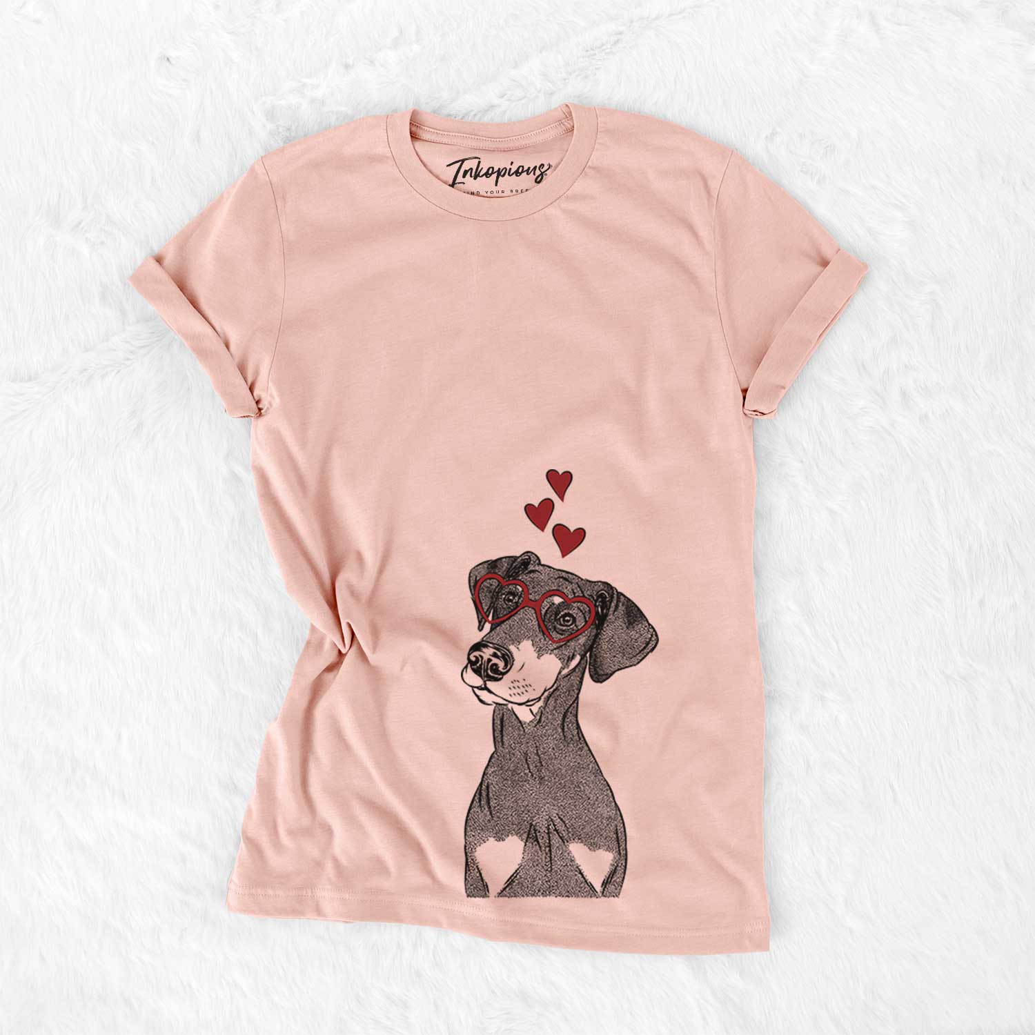 Hand-drawn sketch of Iroh the Doberman Pinscher wearing heart-shaped glasses on a Peach Bella Canvas Unisex Crewneck