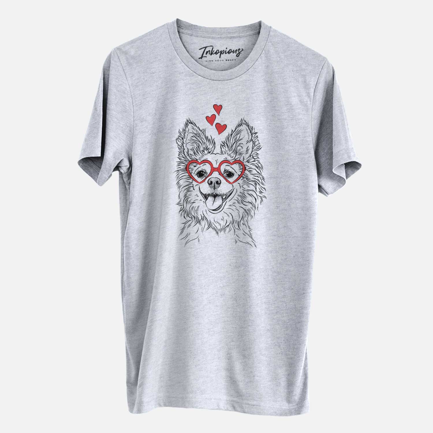 Hand-drawn sketch of Jasper the Pomchi wearing heart-shaped glasses on a Grey Unisex crewneck