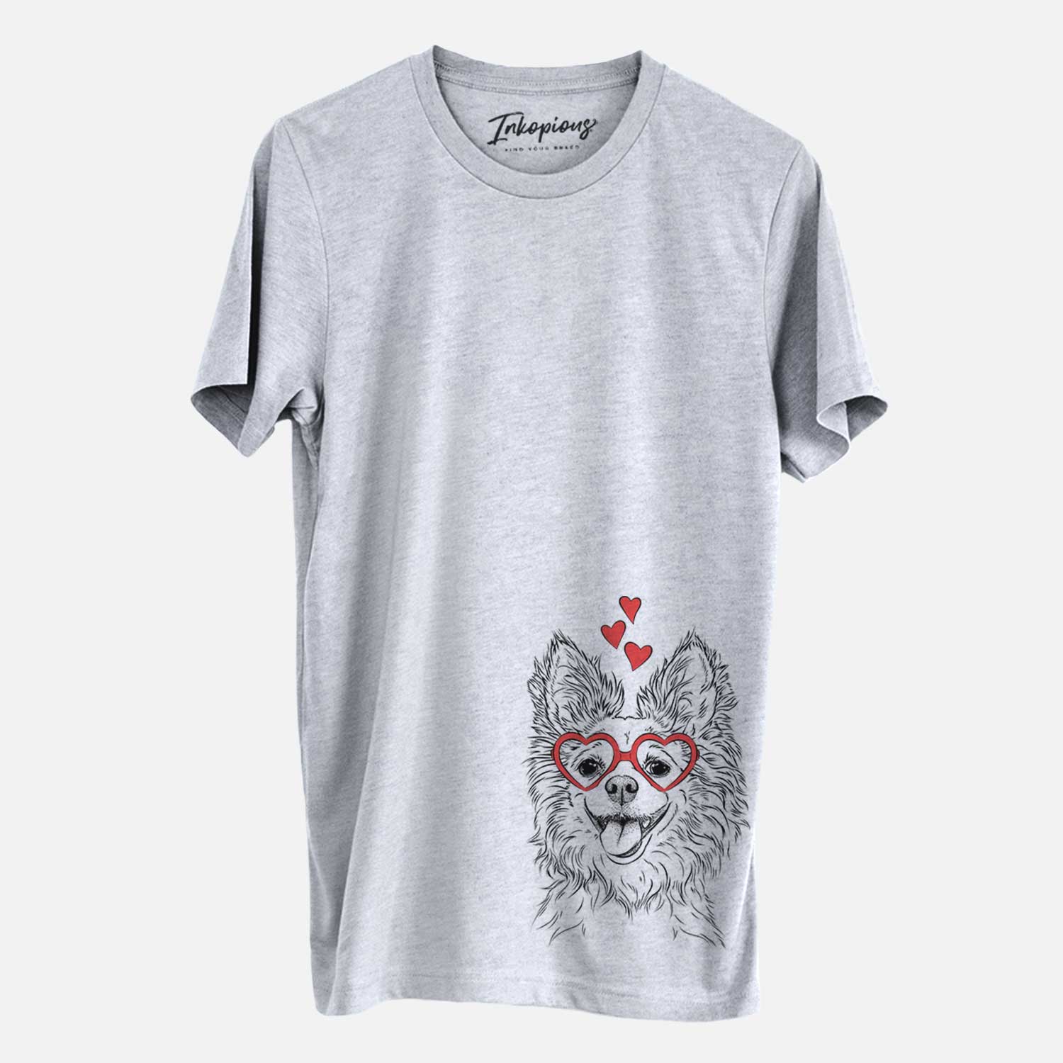 Hand-drawn sketch of Jasper the Pomchi wearing heart-shaped glasses on a Grey Unisex crewneck