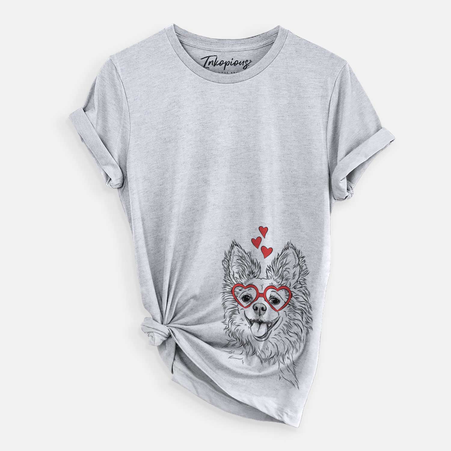Hand-drawn sketch of Jasper the Pomchi wearing heart-shaped glasses on a Grey Unisex crewneck