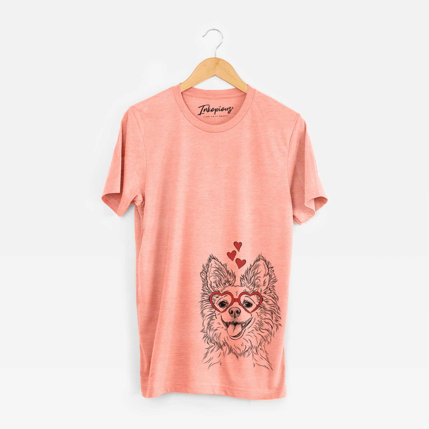 Hand-drawn sketch of Jasper the Pomchi wearing heart-shaped glasses on a Sunset Unisex crewneck