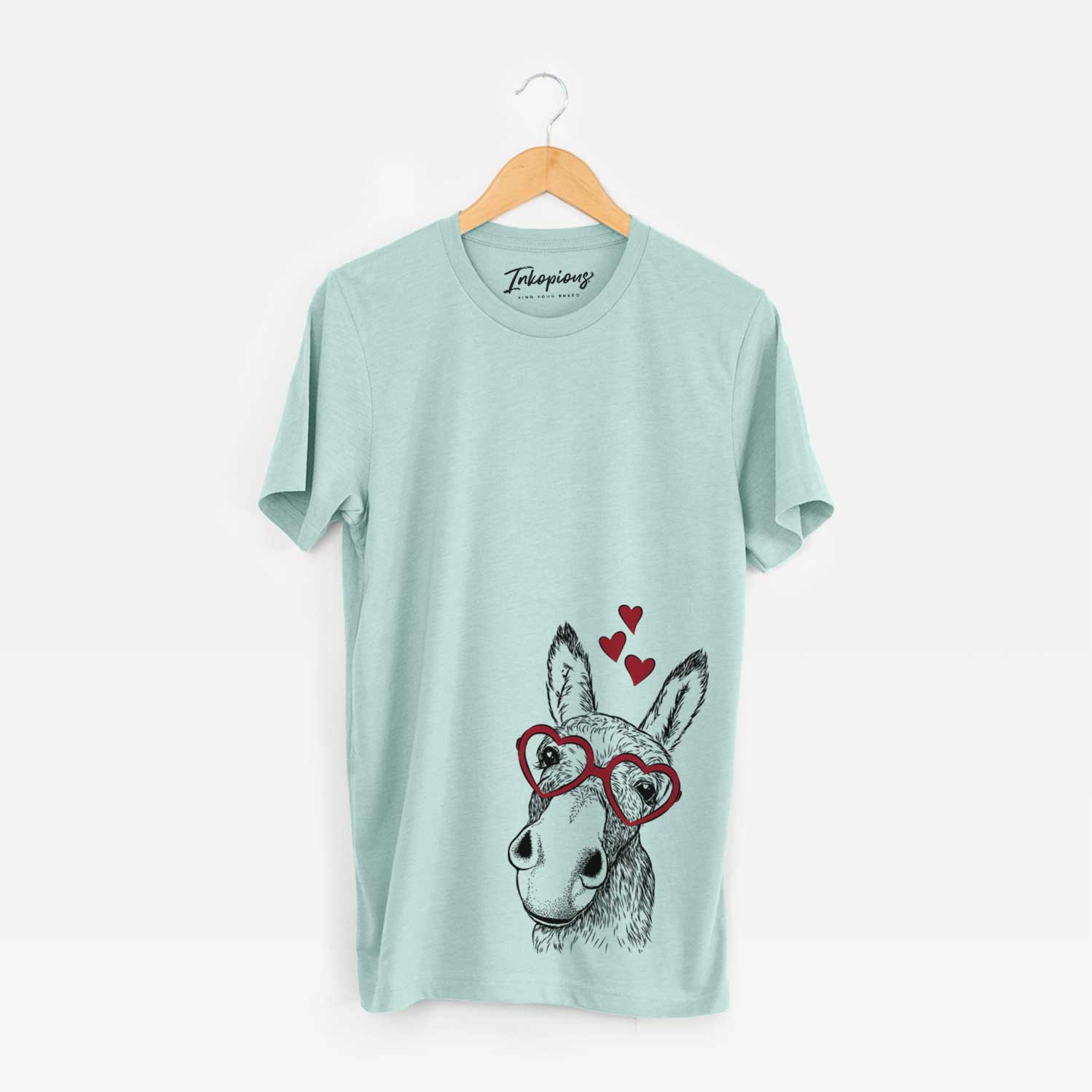 Hand-drawn sketch of Jenny the Donkey wearing heart-shaped glasses on a Heather Sage Bella Canvas Unisex Crewneck