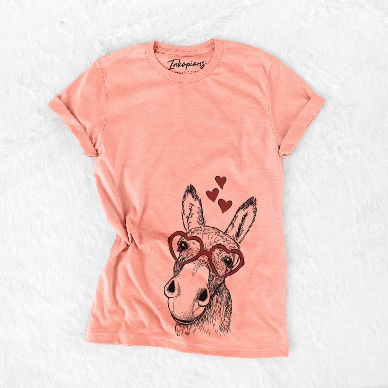 Hand-drawn sketch of Jenny the Donkey wearing heart-shaped glasses on a Sunset Bella Canvas Unisex Crewneck
