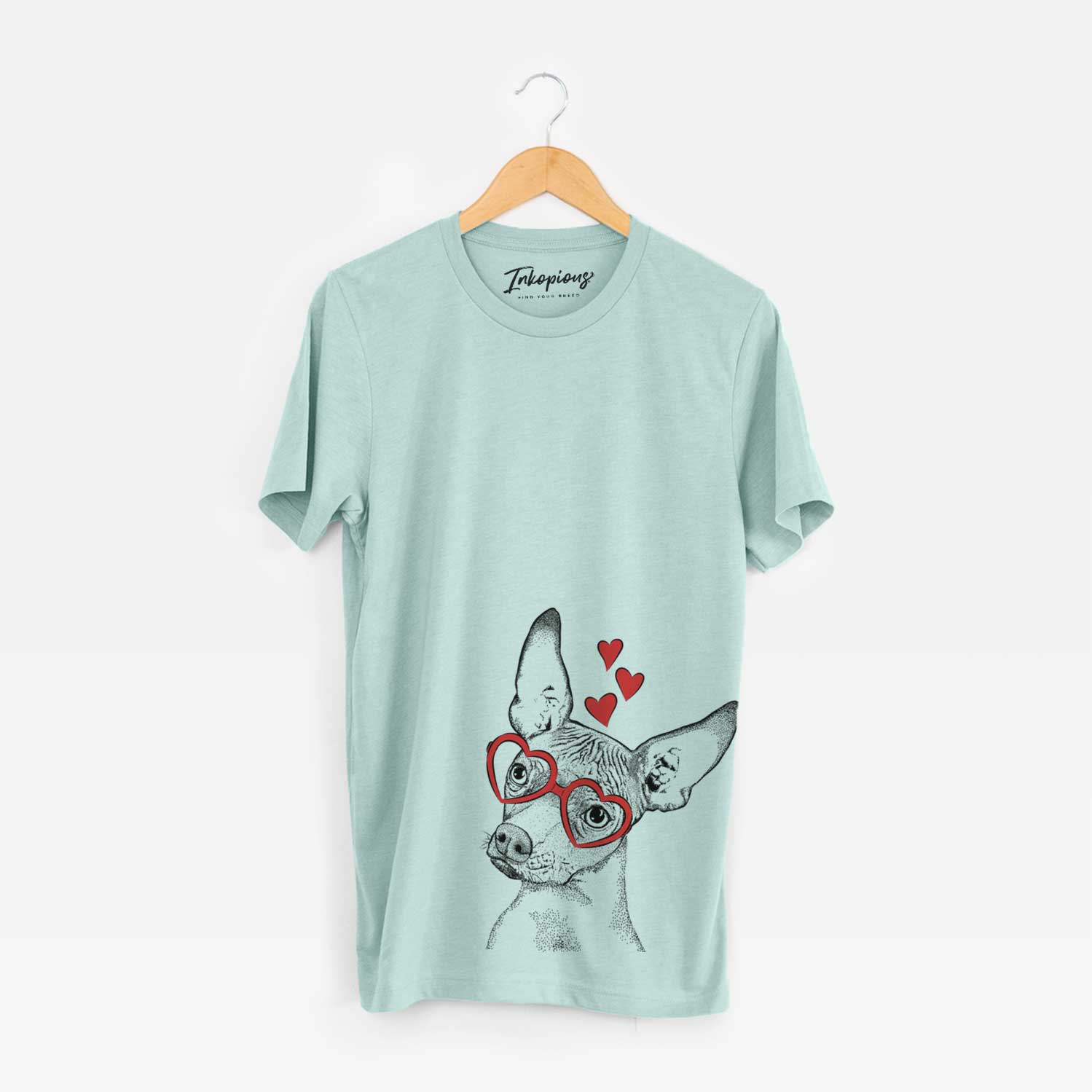 Hand-drawn sketch of Kahlo the Xoloitzcuintli wearing heart-shaped glasses on a Heather Sage Unisex crewneck