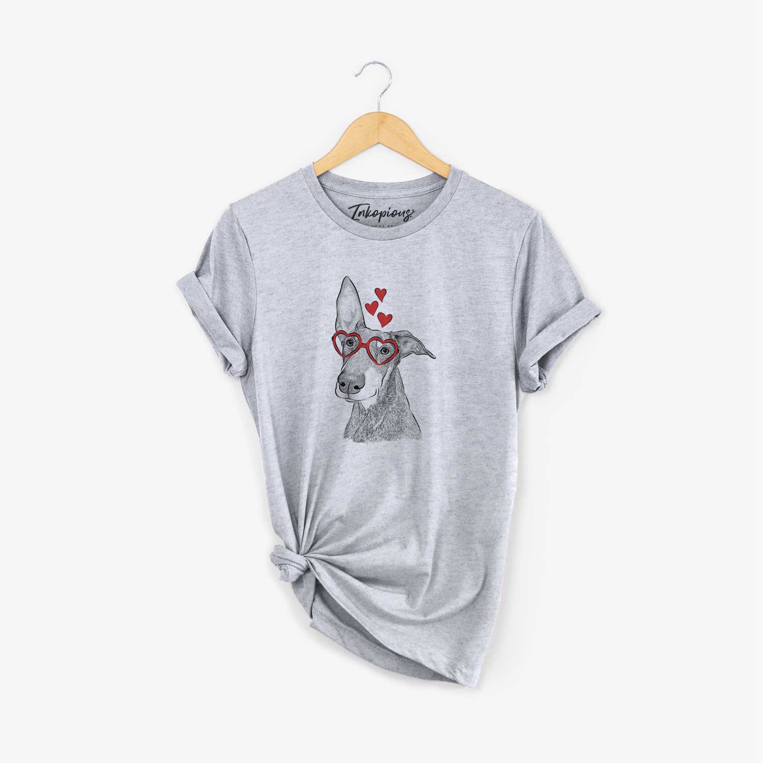 Hand-drawn sketch of Kain the Doberman Pinscher wearing heart-shaped glasses on a Grey Unisex crewneck
