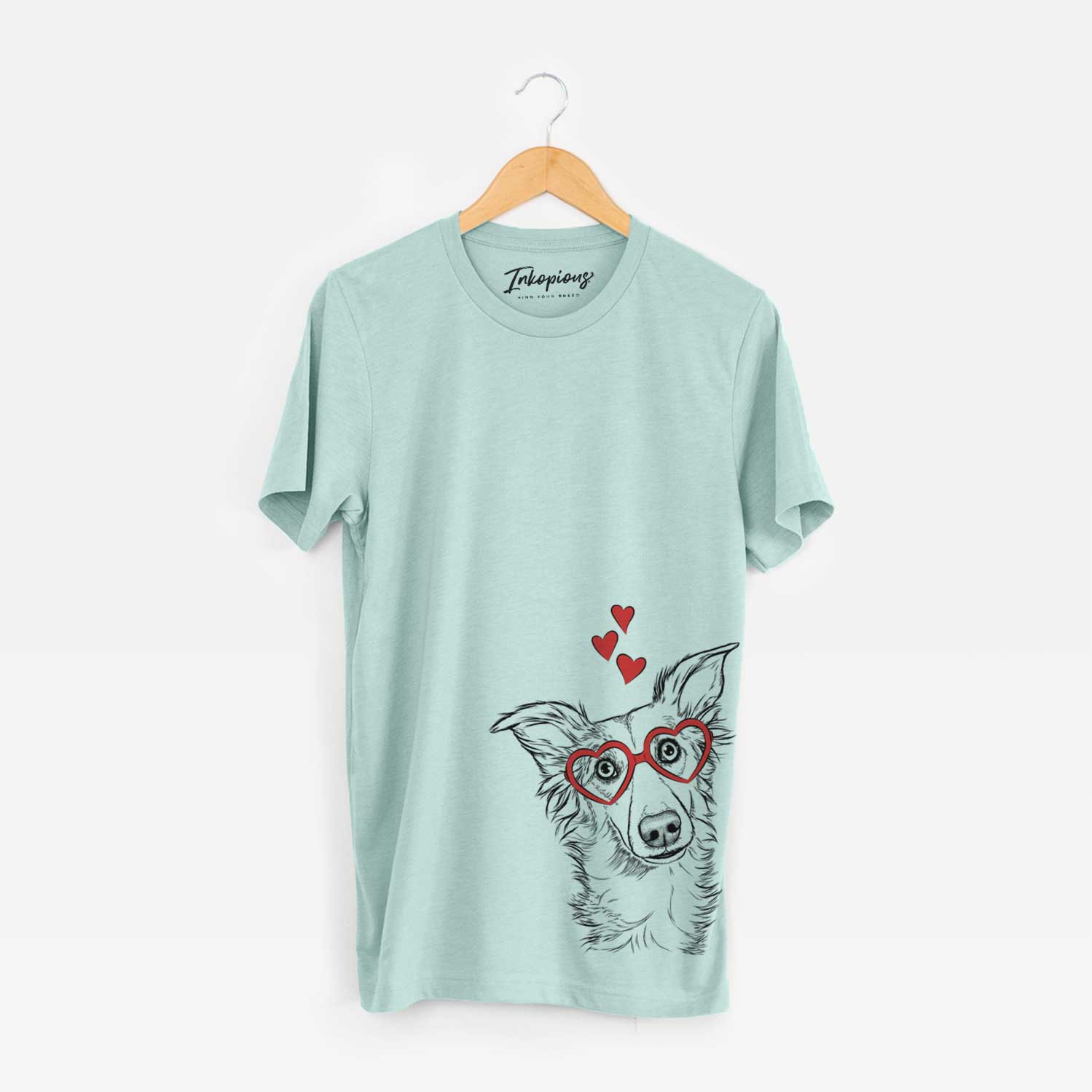 Hand-drawn sketch of Kyu the Windsprite wearing heart-shaped glasses on a Heather Sage Unisex crewneck