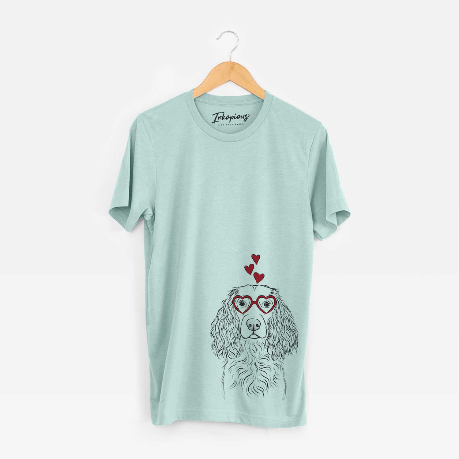Hand-drawn sketch of Landry the Boykin Spaniel wearing heart-shaped glasses on a Heather Sage Bella Canvas Unisex Crewneck