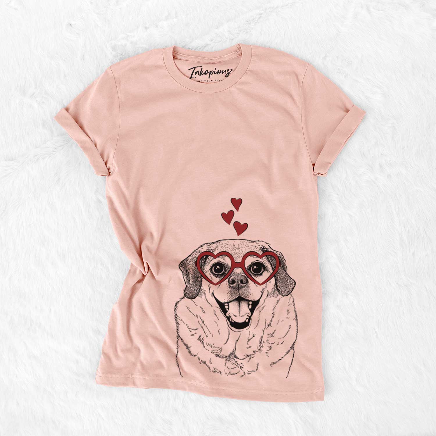 Hand-drawn sketch of LIttle Man the Puggle wearing heart-shaped glasses on a Peach Bella Canvas Unisex Crewneck