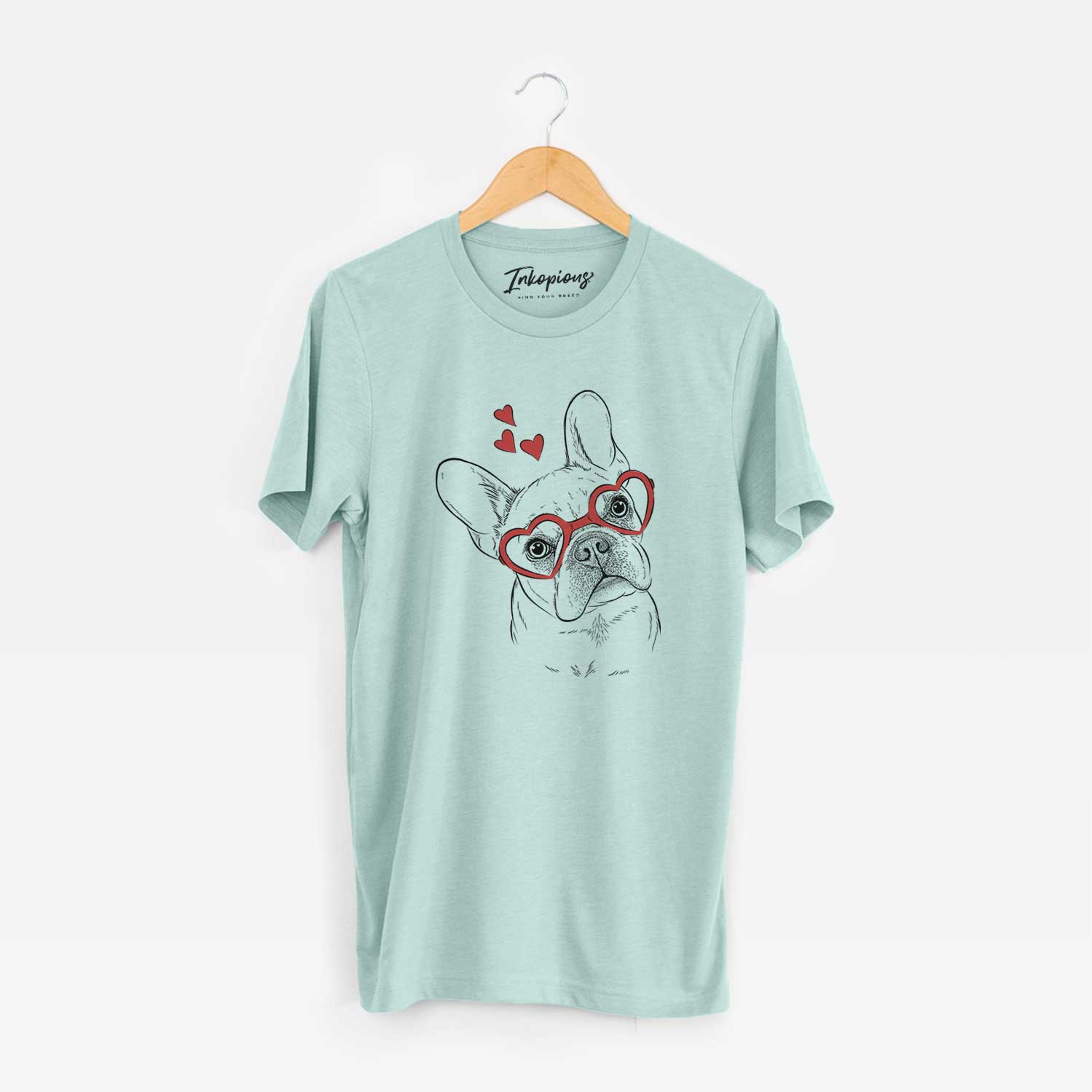 Hand-drawn sketch of Loki the French Bulldog wearing heart-shaped glasses on a Heather Sage Unisex crewneck